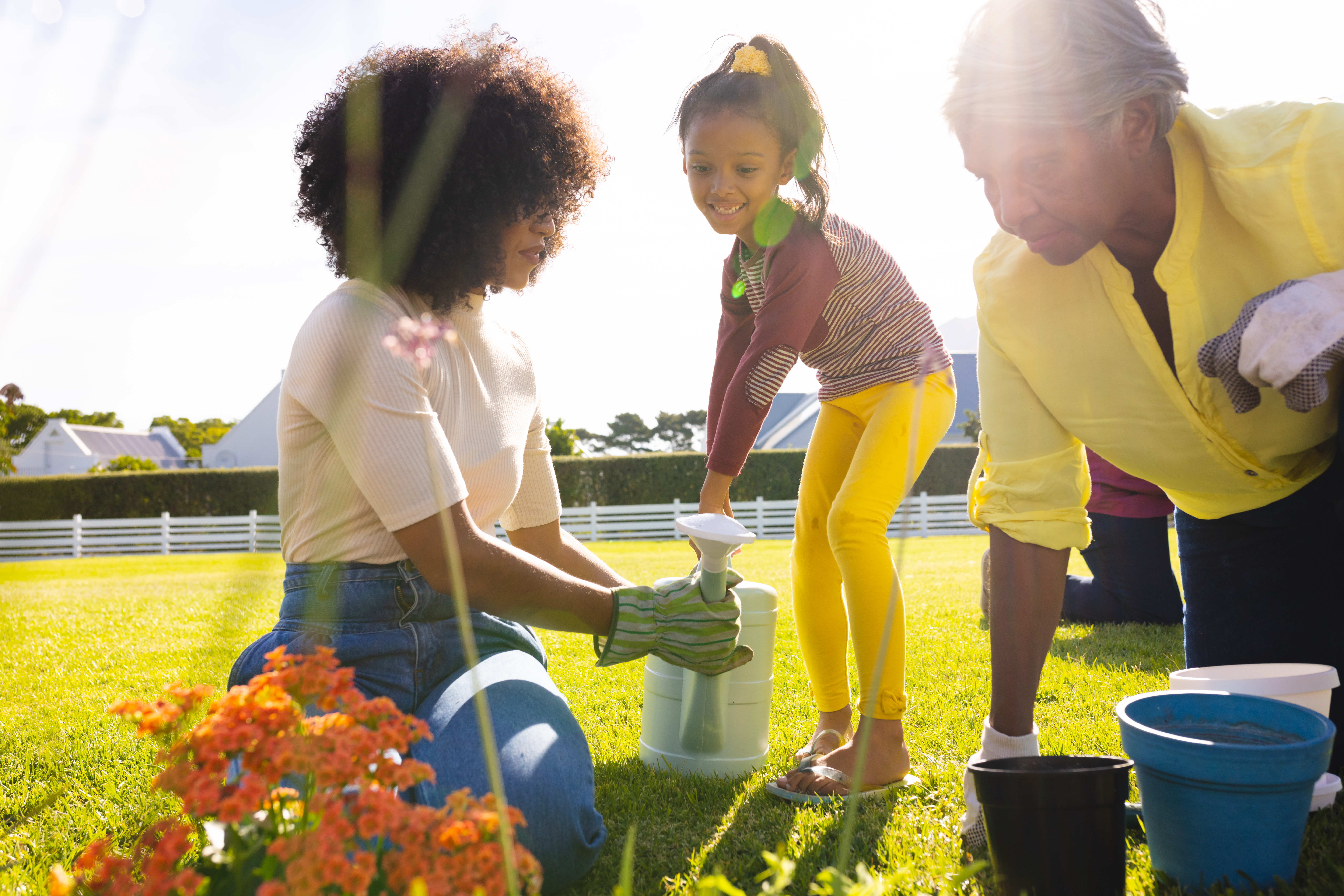 The mother sets herself as a role model for her child by teaching her to handle objects with care. The mother sets herself as a role model for her child by teaching her to handle objects with care.