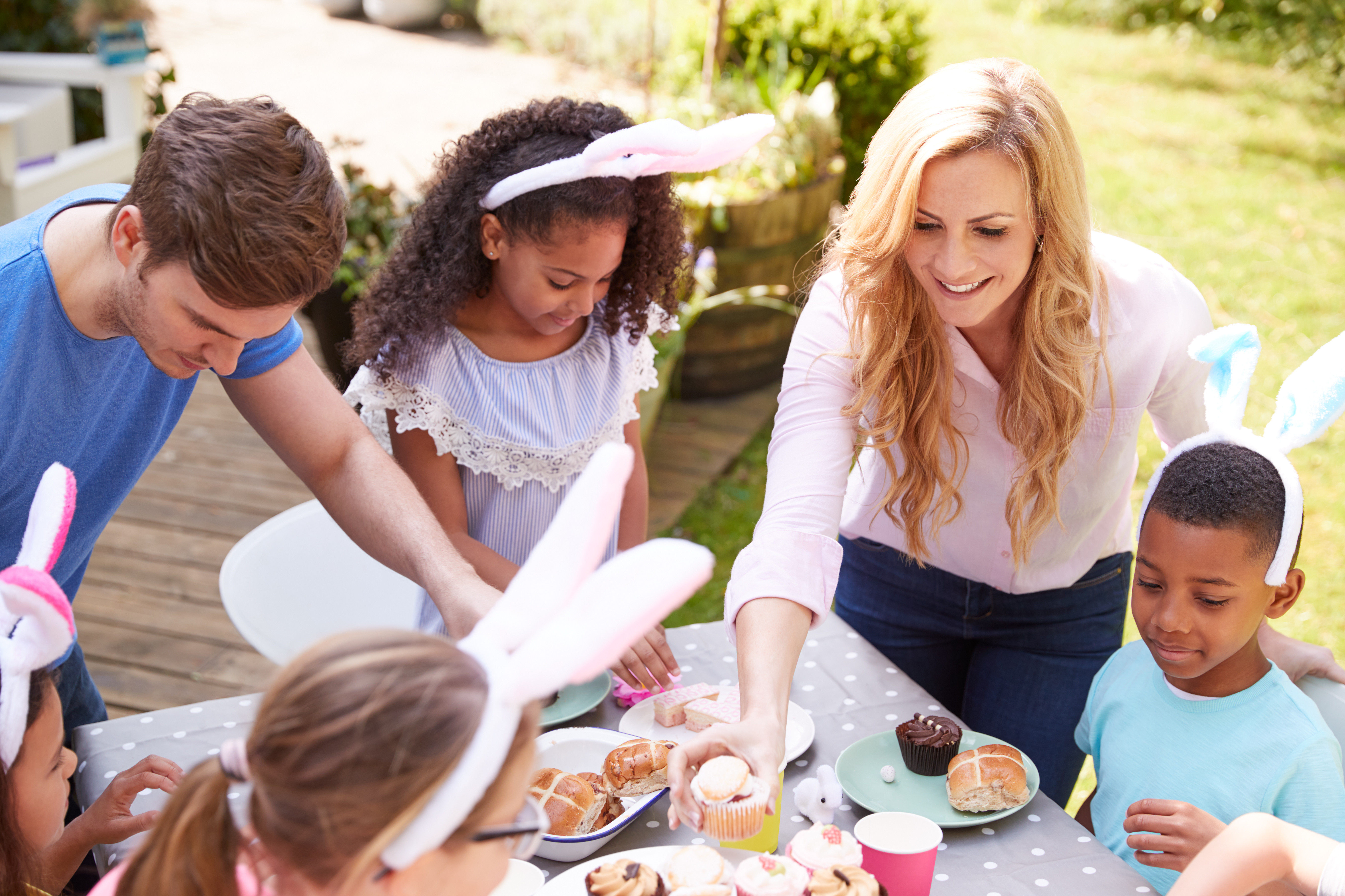 The parents join their children in creating imaginative scenarios, such as a tea party. The parents join their children in creating imaginative scenarios, such as a tea party.