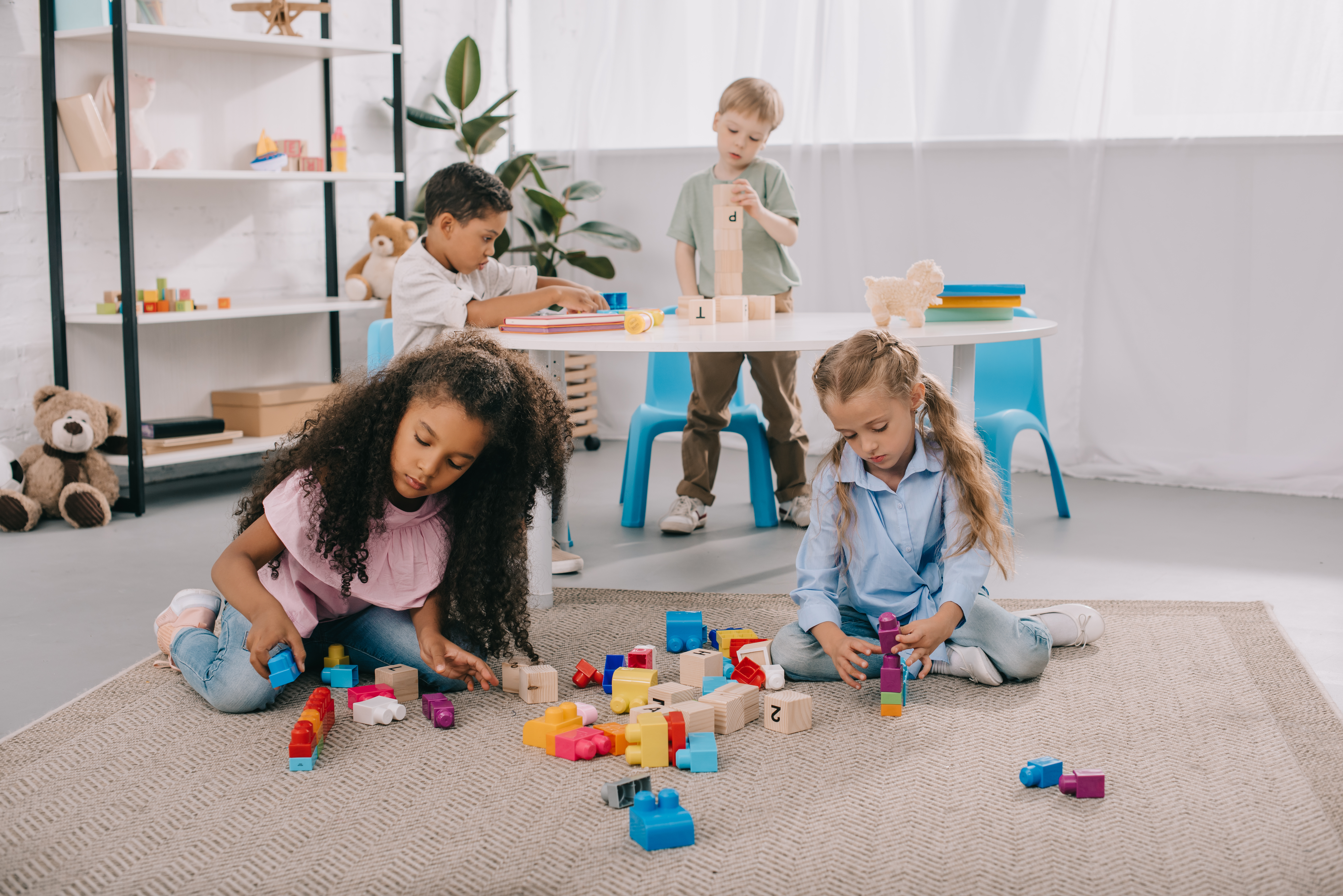 The children are deeply focused on educational games that hold their full attention. The children are deeply focused on educational games that hold their full attention.