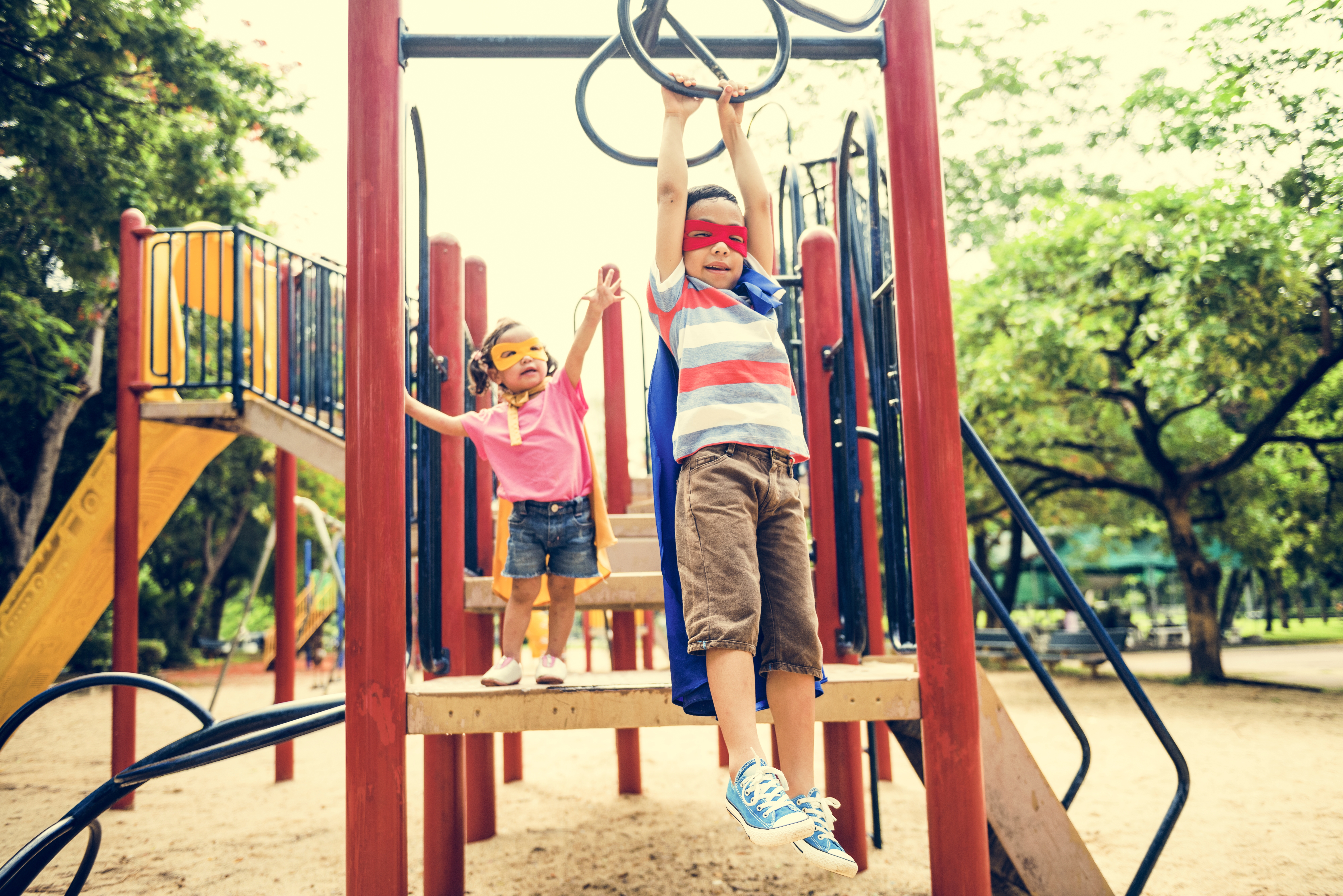 Two kids pretended to be superheroes, and the playground became their imaginary training ground. Two kids pretended to be superheroes, and the playground became their imaginary training ground.