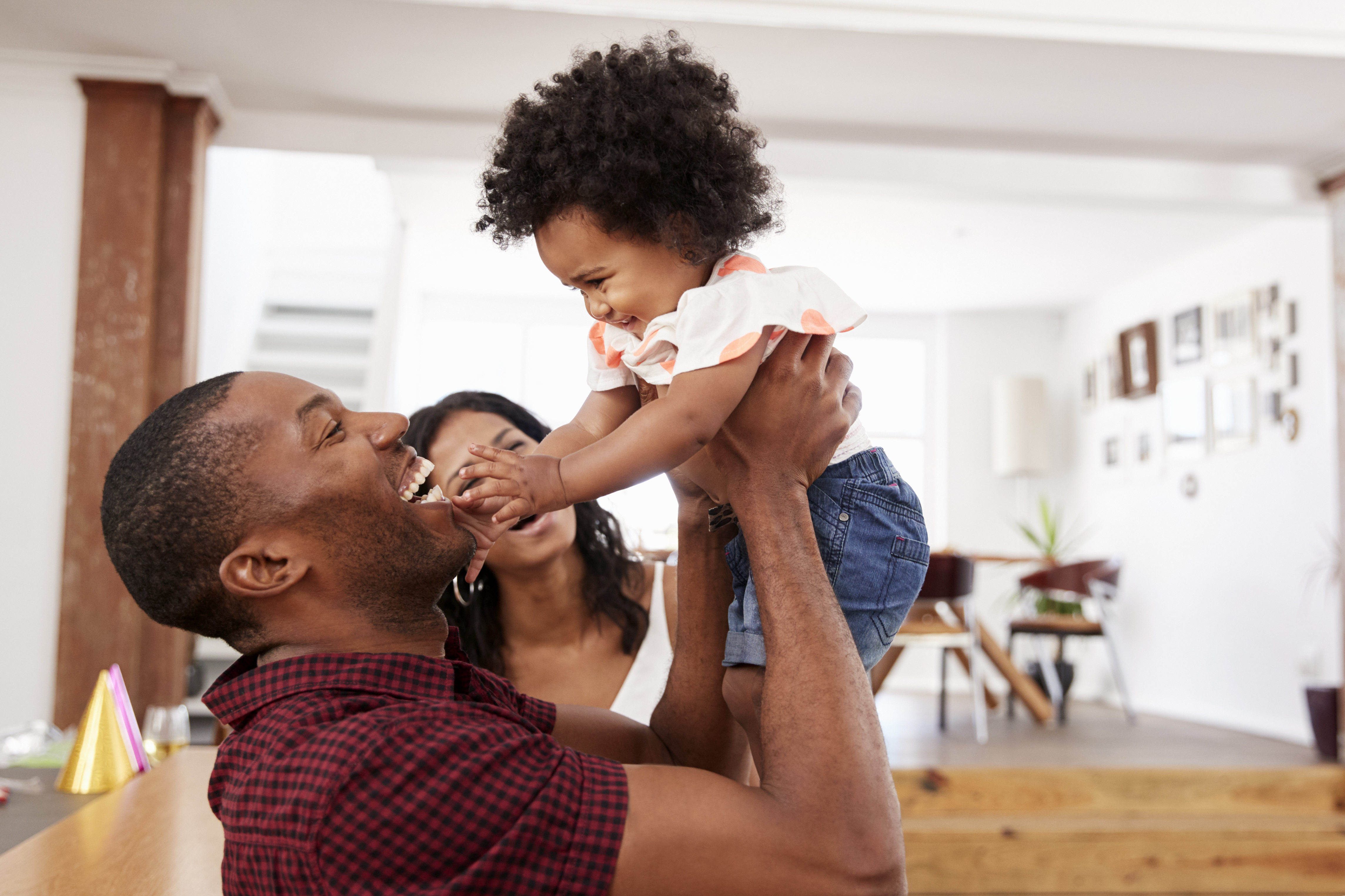 The family joyfully faces the challenges of life as they raise their child. The family joyfully faces the challenges of life as they raise their child.