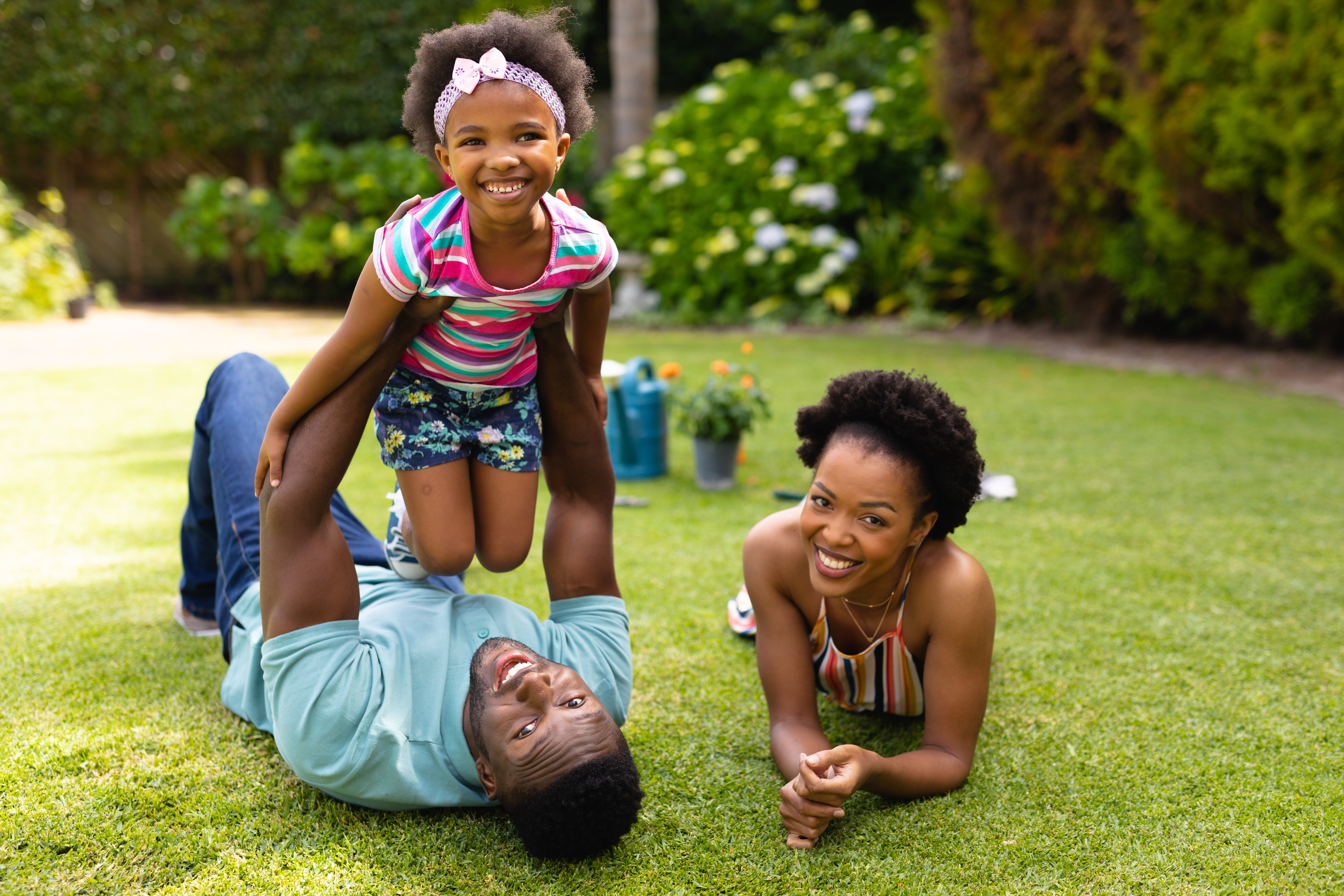 The family joyfully plays and savors the beauty of nature together. The family joyfully plays and savors the beauty of nature together.