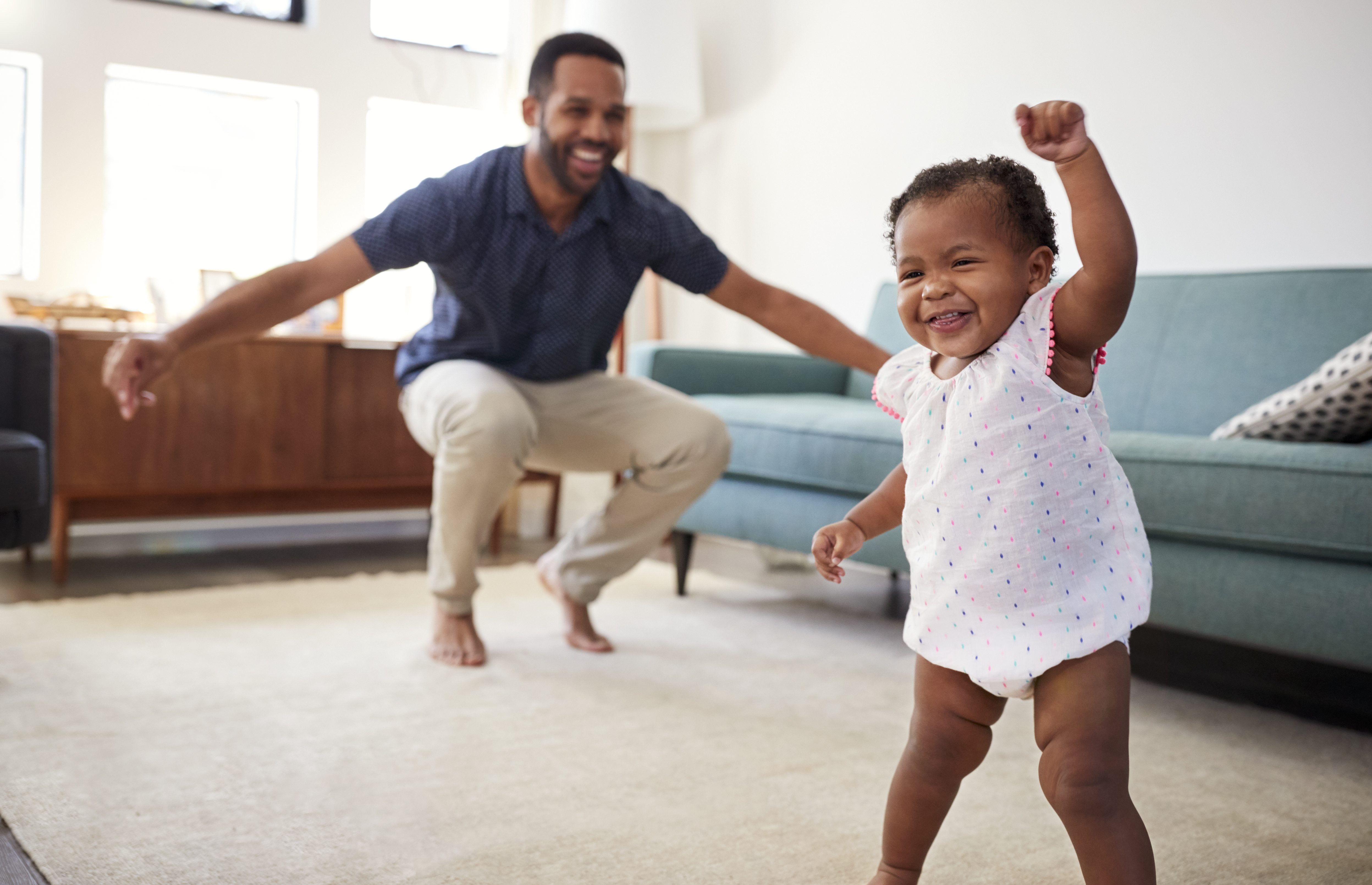 The parents cherish the moments of their child's growth and learning, knowing they will be fond memories to look back on in the future. The parents cherish the moments of their child's growth and learning, knowing they will be fond memories to look back on in the future.