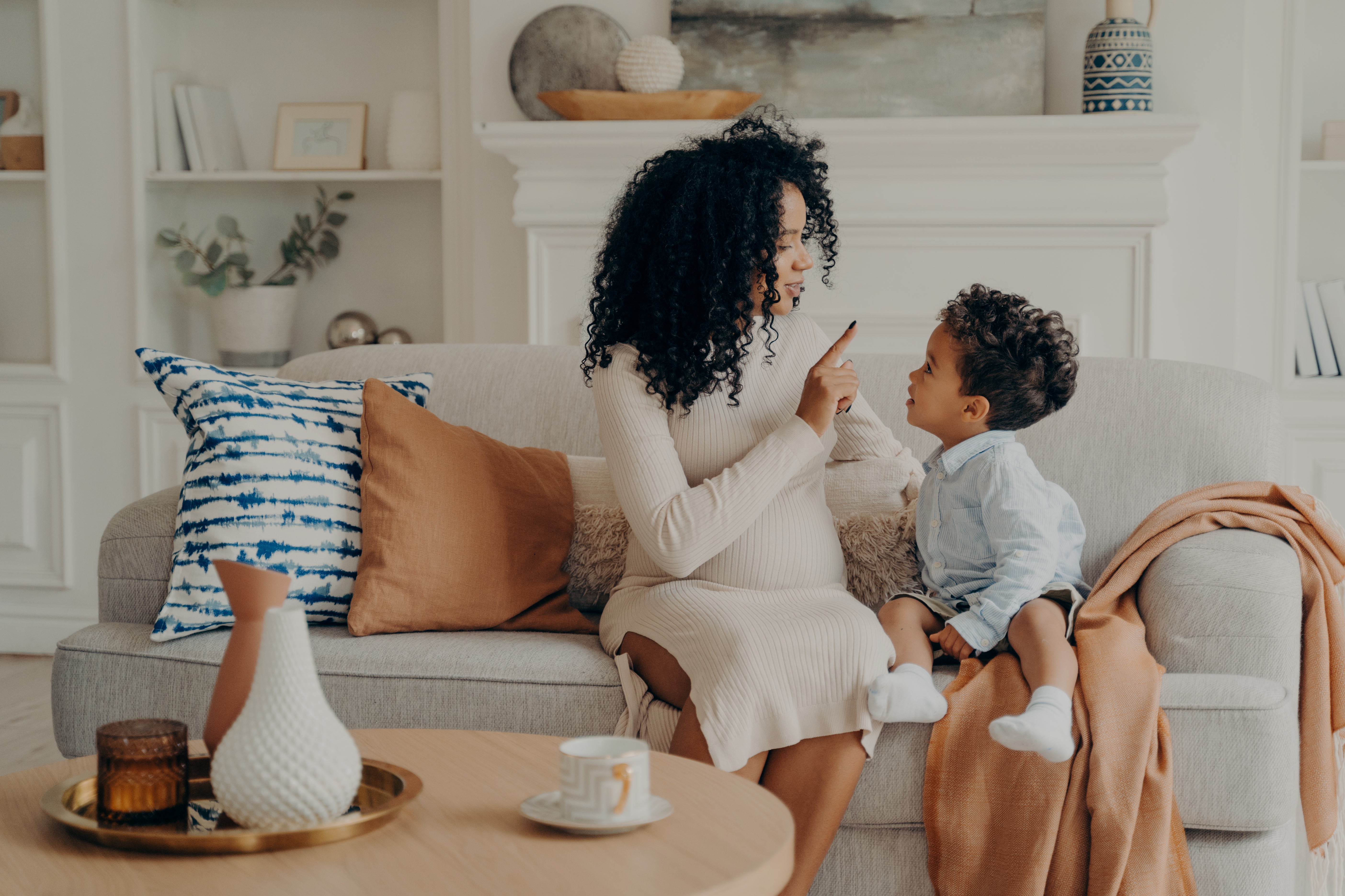 The mother comforts her child and explains that what she says and any decisions she makes are for the child's own good The mother comforts her child and explains that what she says and any decisions she makes are for the child's own good