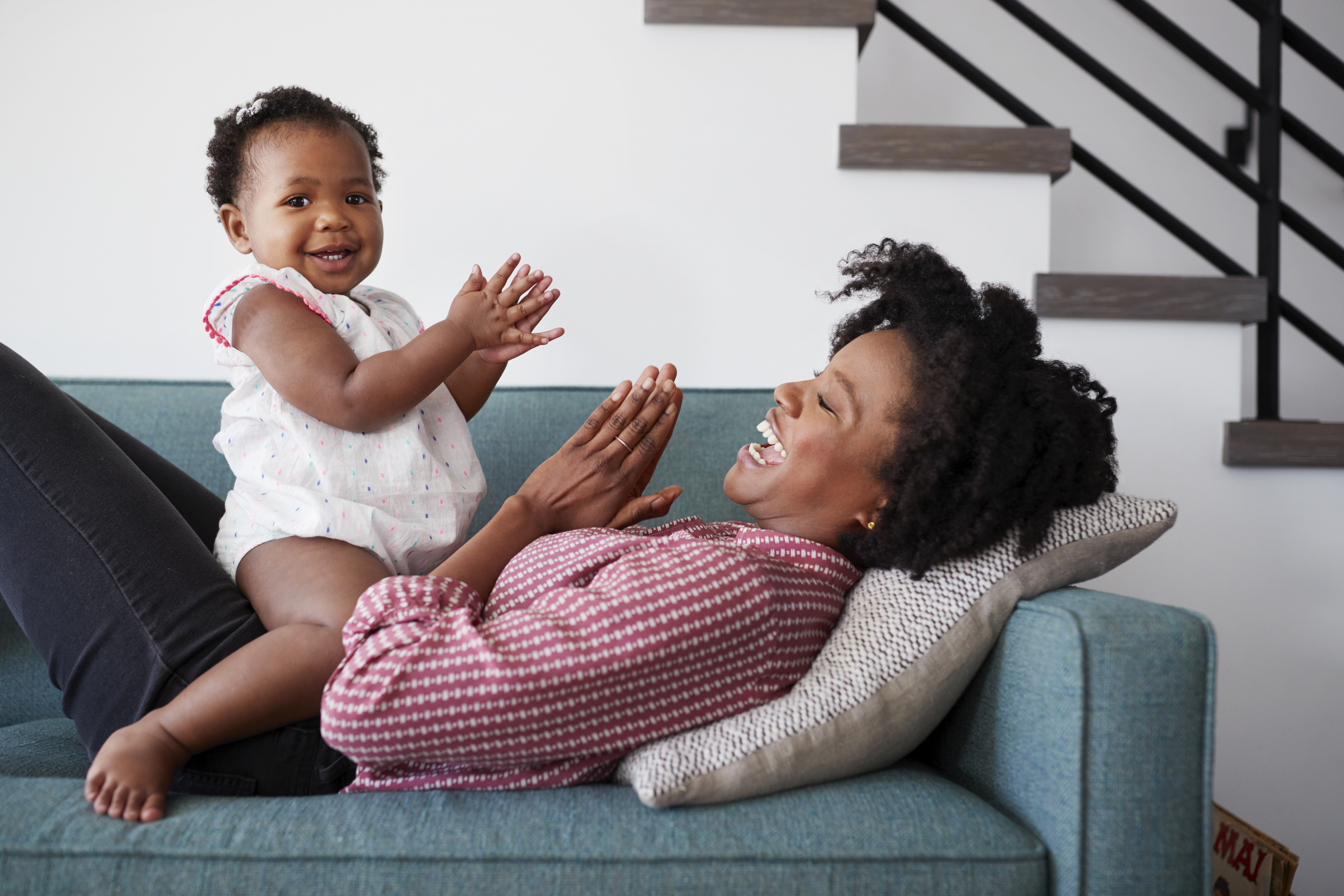 The mother joyfully plays with her child and builds a strong foundation of love and learning for the child's growth The mother joyfully plays with her child and builds a strong foundation of love and learning for the child's growth