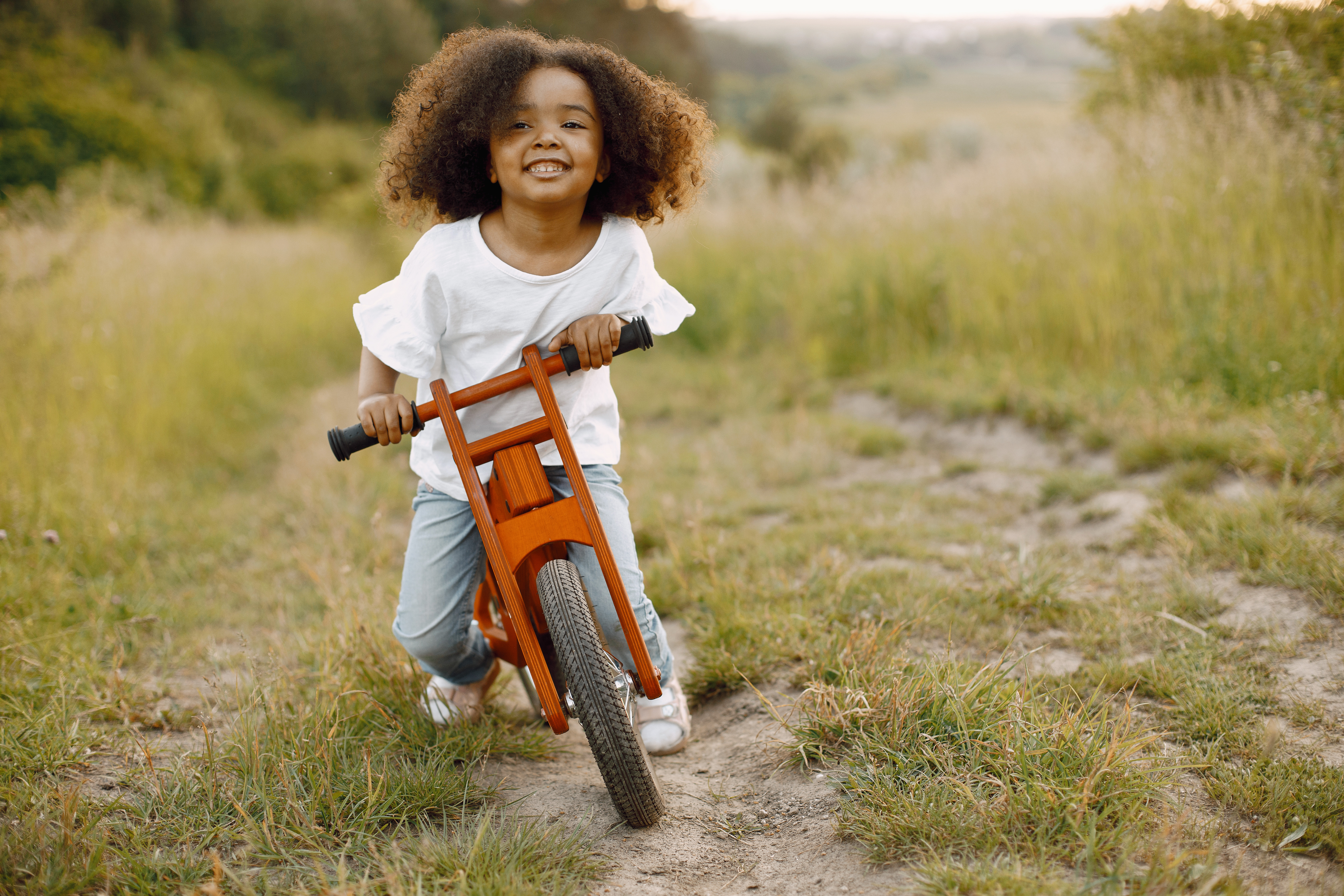 The child is now able to ride a bike without training wheels. The child is now able to ride a bike without training wheels.