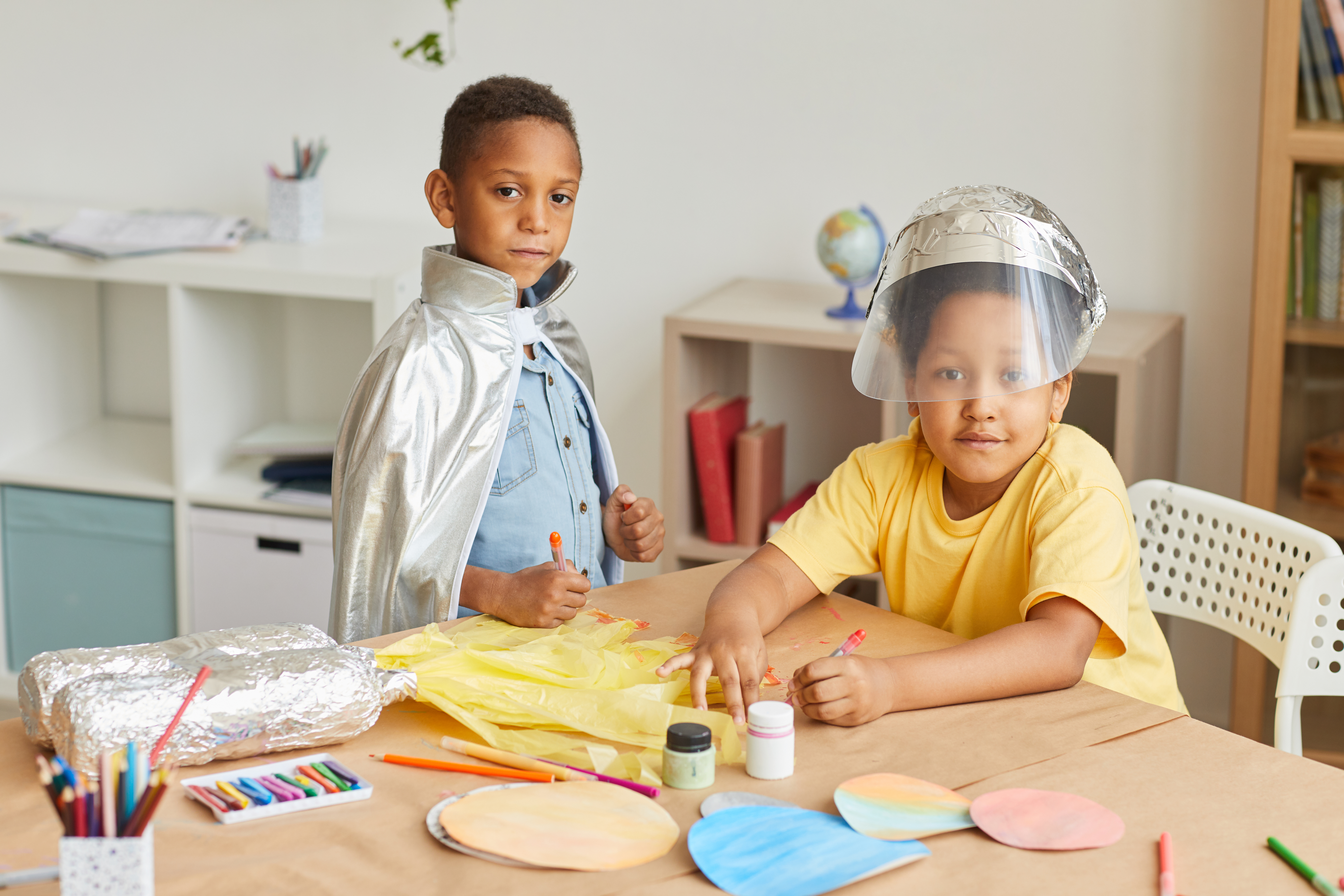 Boys crafting space suits Boys crafting space suits