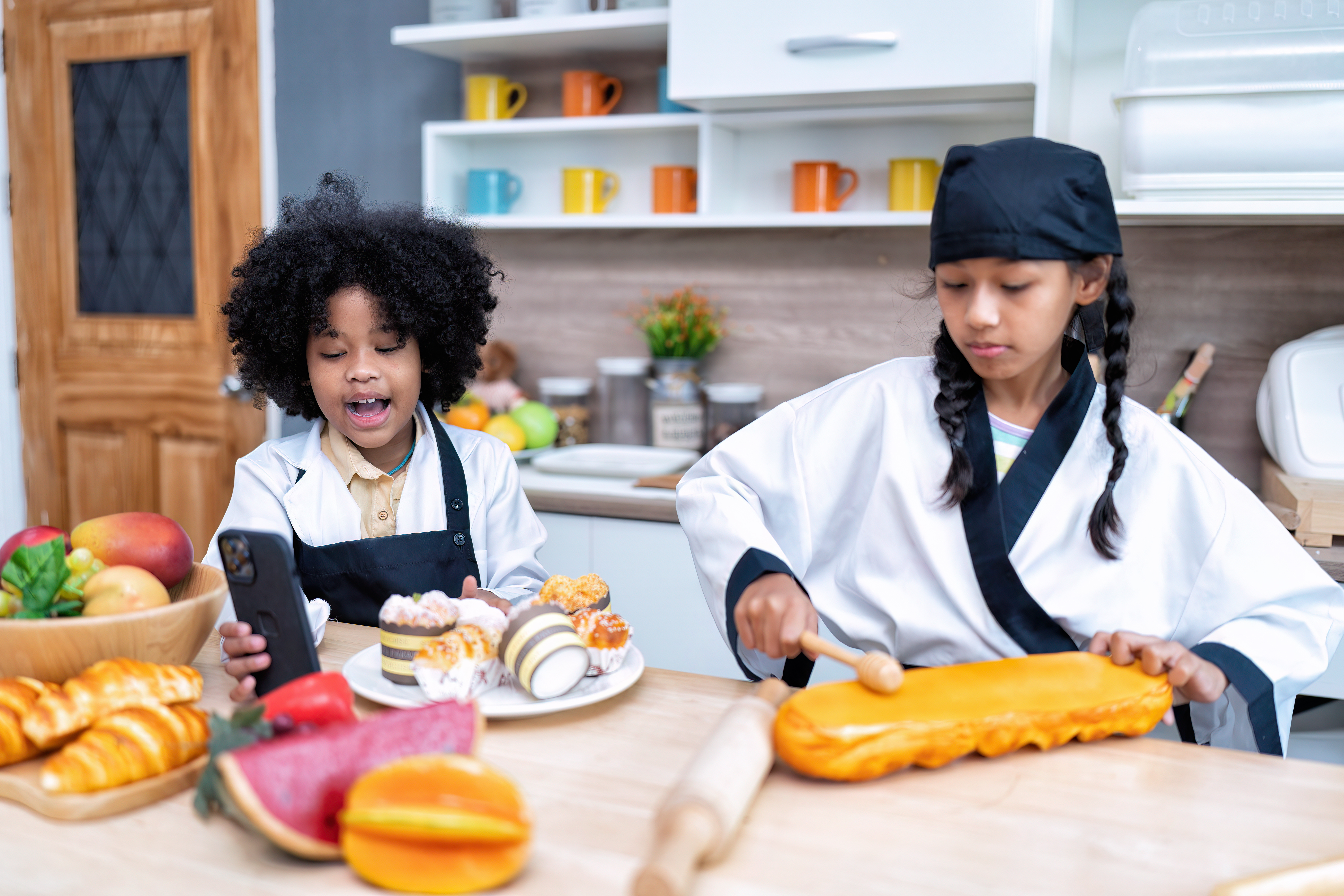 Two girls pretend play making bread Two girls pretend play making bread