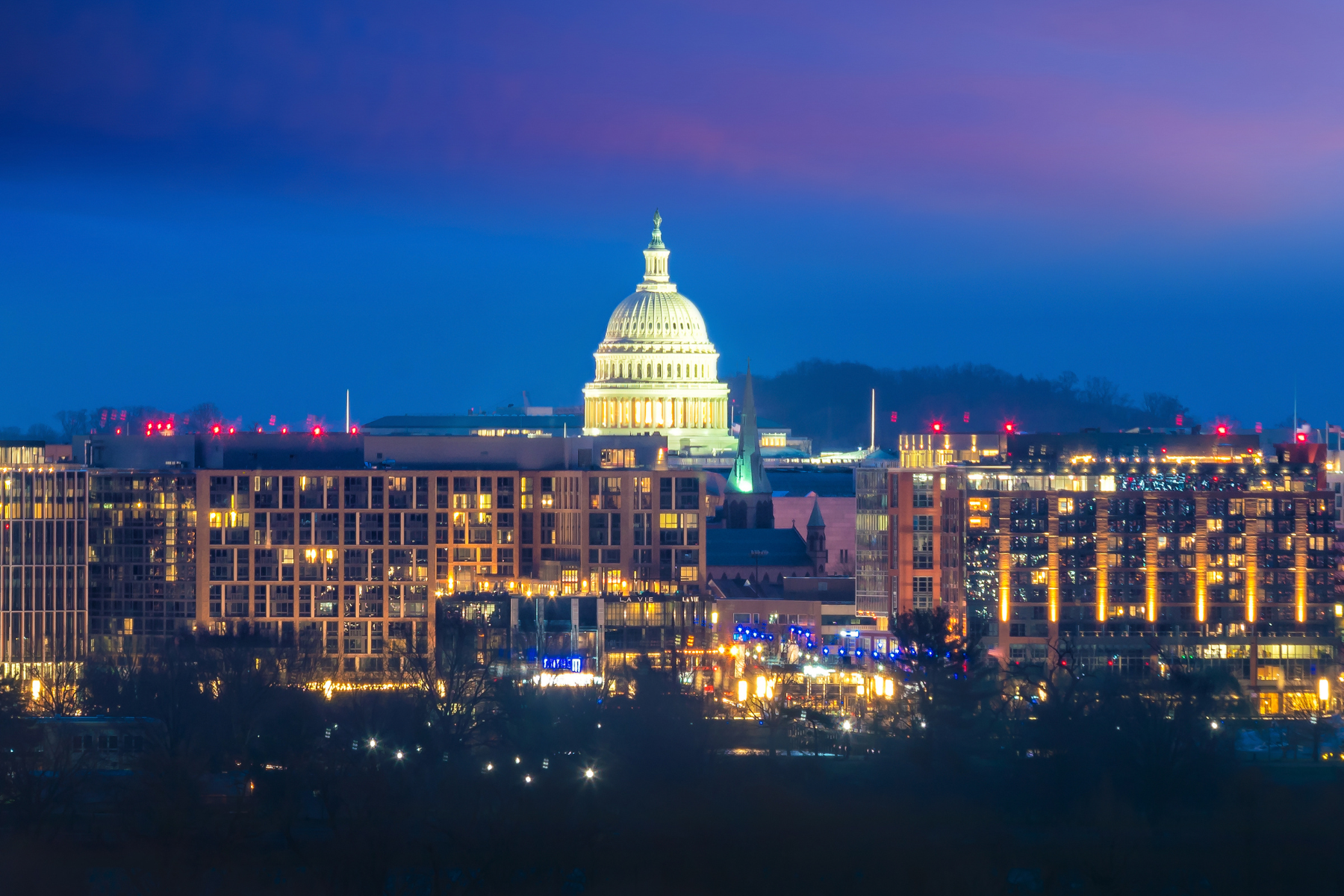 Night view of the U.S. Capitol building and Washington, D.C. skyline, highlighting urban accessibility and proximity to Northern Virginia neighborhoods. Night view of the U.S. Capitol building and Washington, D.C. skyline, highlighting urban accessibility and proximity to Northern Virginia neighborhoods.