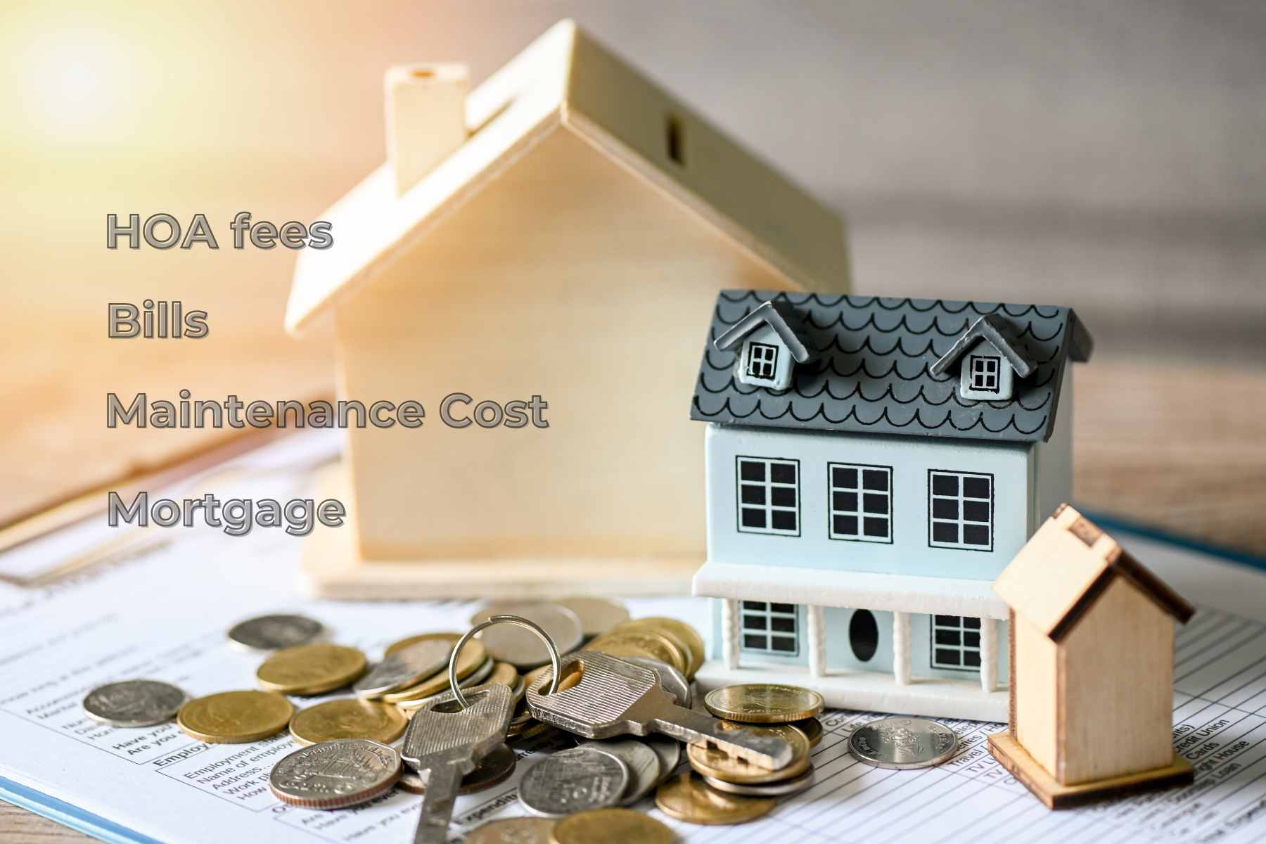 The image shows miniature houses, coins, and keys placed over documents, with text listing "HOA fees, Bills, Maintenance Cost, Mortgage"—highlighting the real costs buyers need to budget for beyond the purchase price. The image shows miniature houses, coins, and keys placed over documents, with text listing "HOA fees, Bills, Maintenance Cost, Mortgage"—highlighting the real costs buyers need to budget for beyond the purchase price.