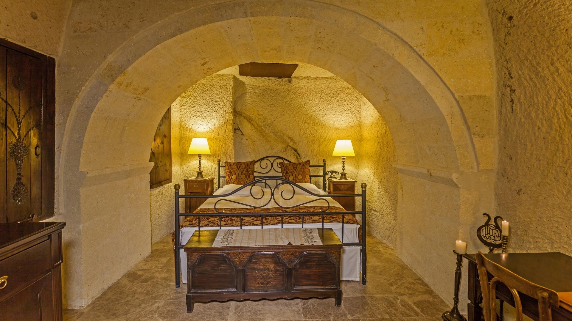French bed in classic room at historic Yunak Evleri Cappadocia