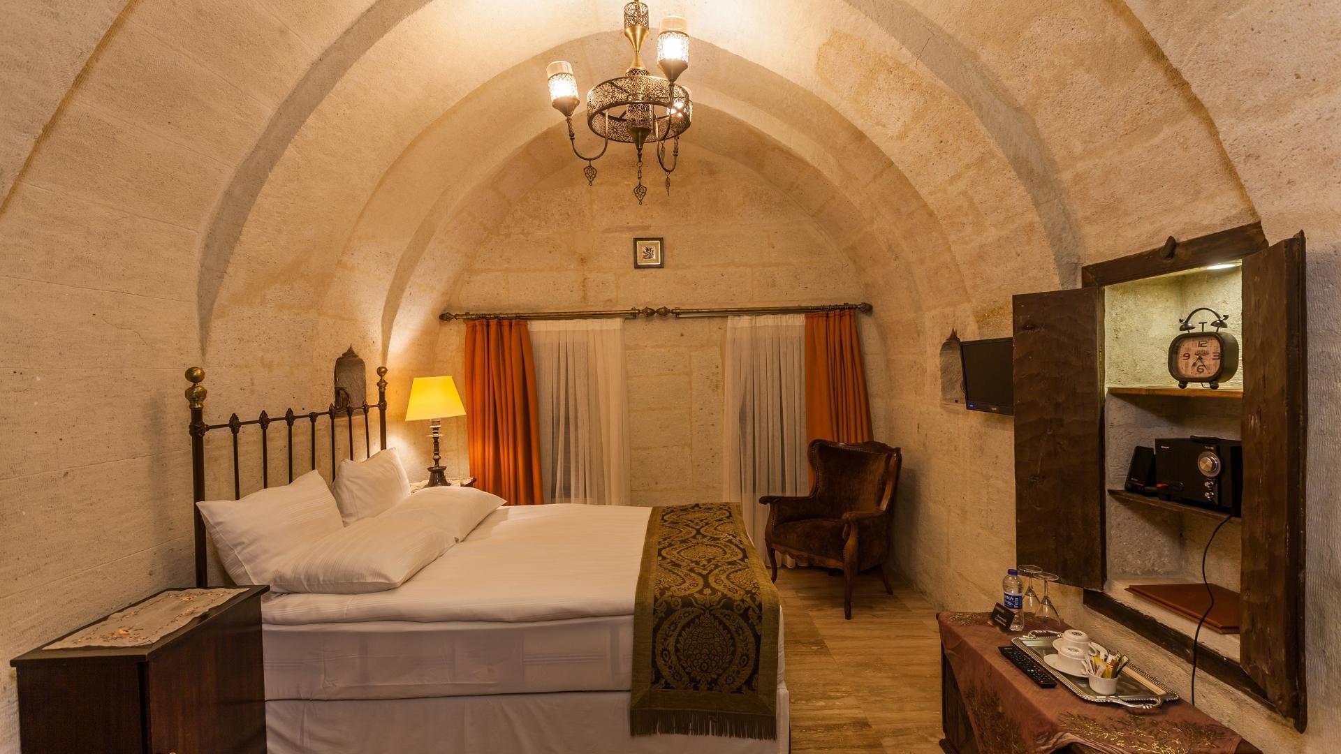 French bed in 35m2 classic room at historic Yunak Evleri Cappadocia