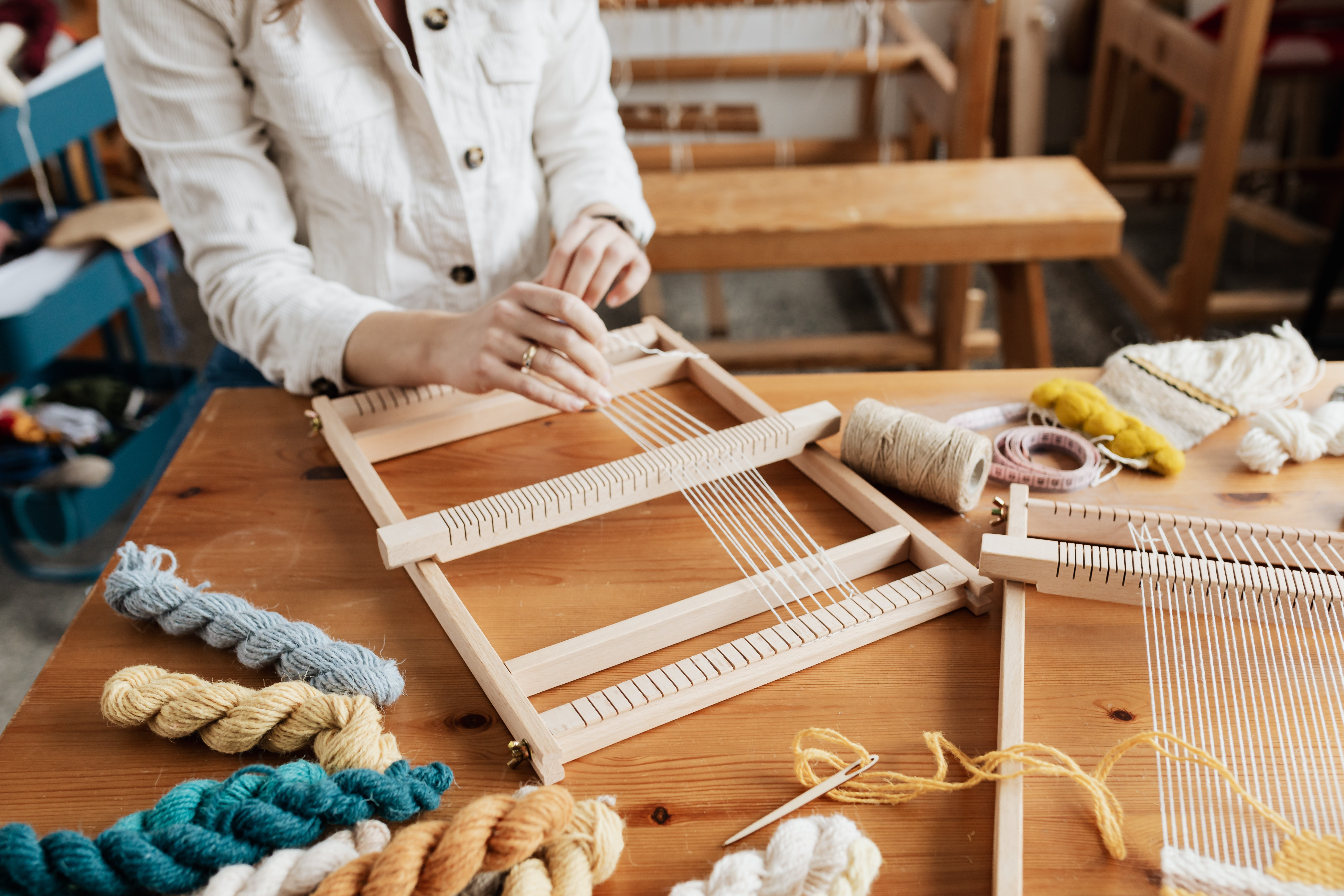 hands at a loom