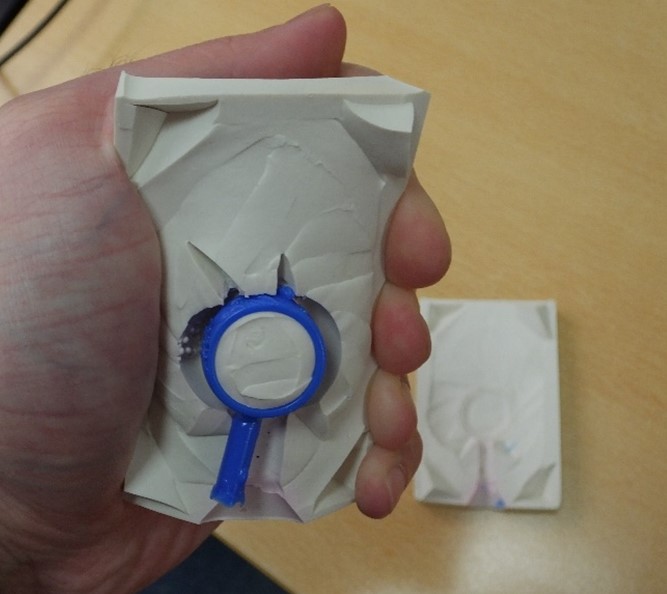 An example of a silicone mould (white) with wax (blue) injected into it An example of a silicone mould (white) with wax (blue) injected into it
