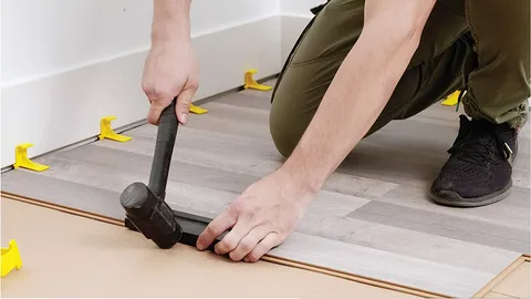 Using a Rubber Mallet or Hammer Directly on the Planks Using a Rubber Mallet or Hammer Directly on the Planks