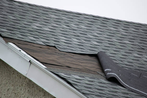 Storm-damaged roof in Northern Virginia – missing shingles and debris after high winds Storm-damaged roof in Northern Virginia – missing shingles and debris after high winds