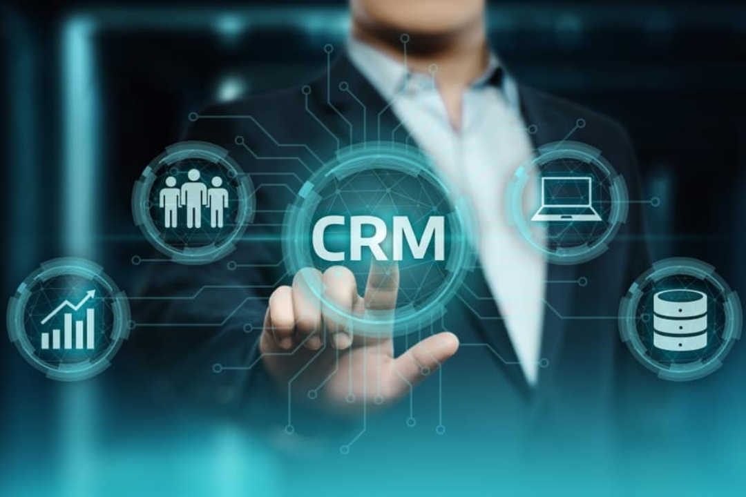 hands selecting "CRM" on a digital interface with icons representing customer data and analytics, showcasing lead scoring systems for real estate by AMPLIFIREI. hands selecting "CRM" on a digital interface with icons representing customer data and analytics, showcasing lead scoring systems for real estate by AMPLIFIREI.