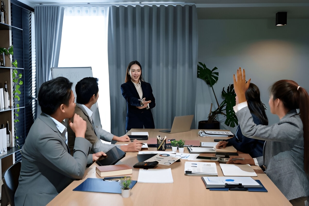 A presenter gestures during a business meeting, highlighting key aspects of choosing a property investor CRM with AMPLIFIREI. A presenter gestures during a business meeting, highlighting key aspects of choosing a property investor CRM with AMPLIFIREI.
