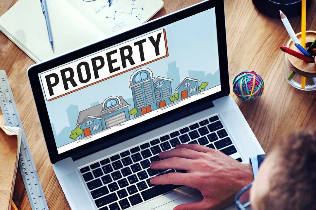  A person works on a laptop with a house icon and various other icons, a representation of AMPLIFIREI's services for using autoresponders for investor leads.