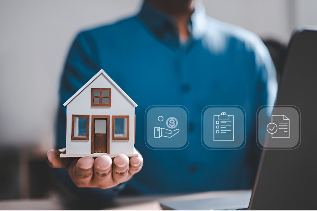 A person's hand holds a small model house, with digital icons related to finance and documents floating nearby, representing digital marketing tips for property flippers, offered by AMPLIFIREI.