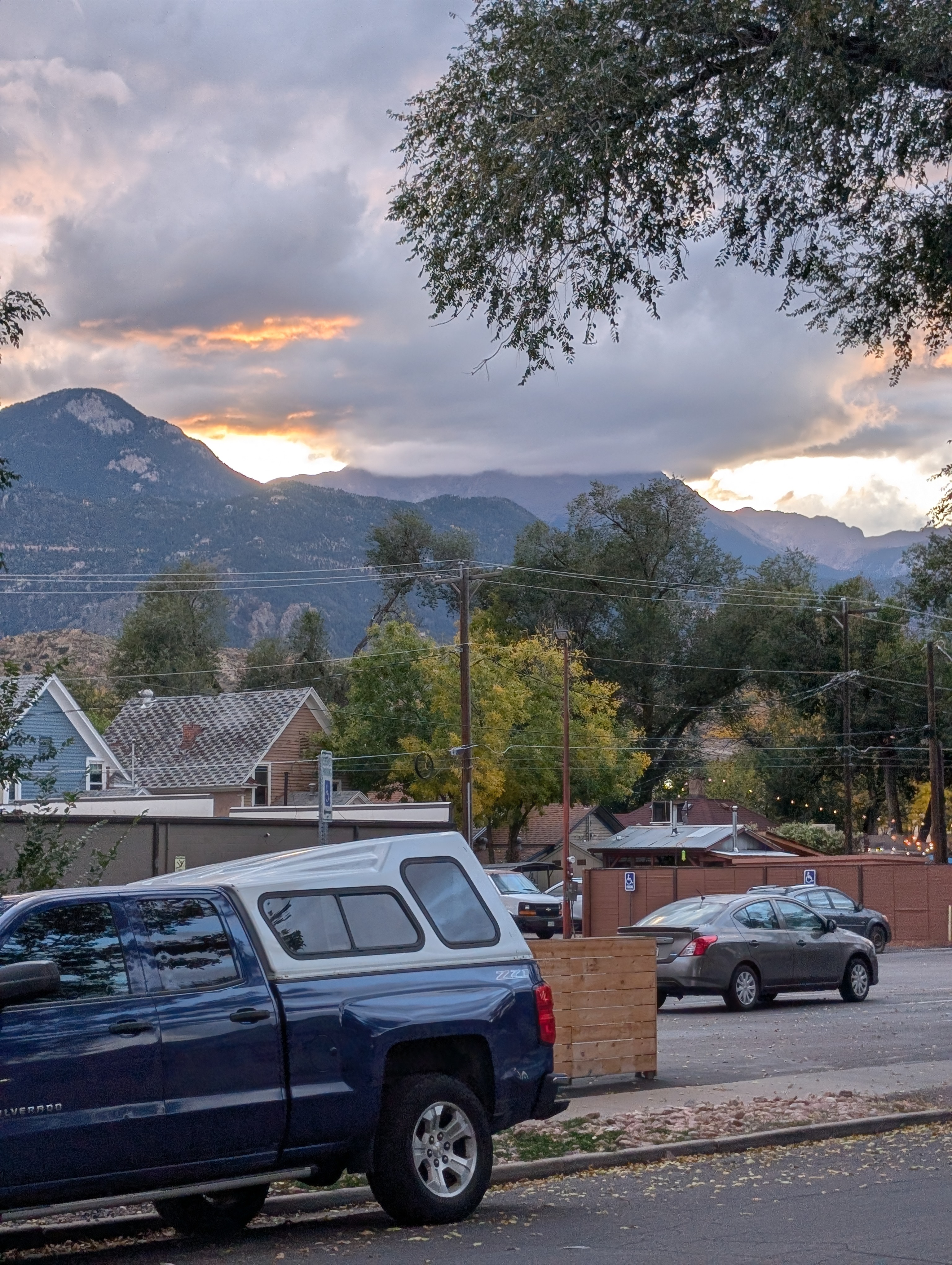 A charming historic street in Old Colorado City with brick buildings and storefronts.