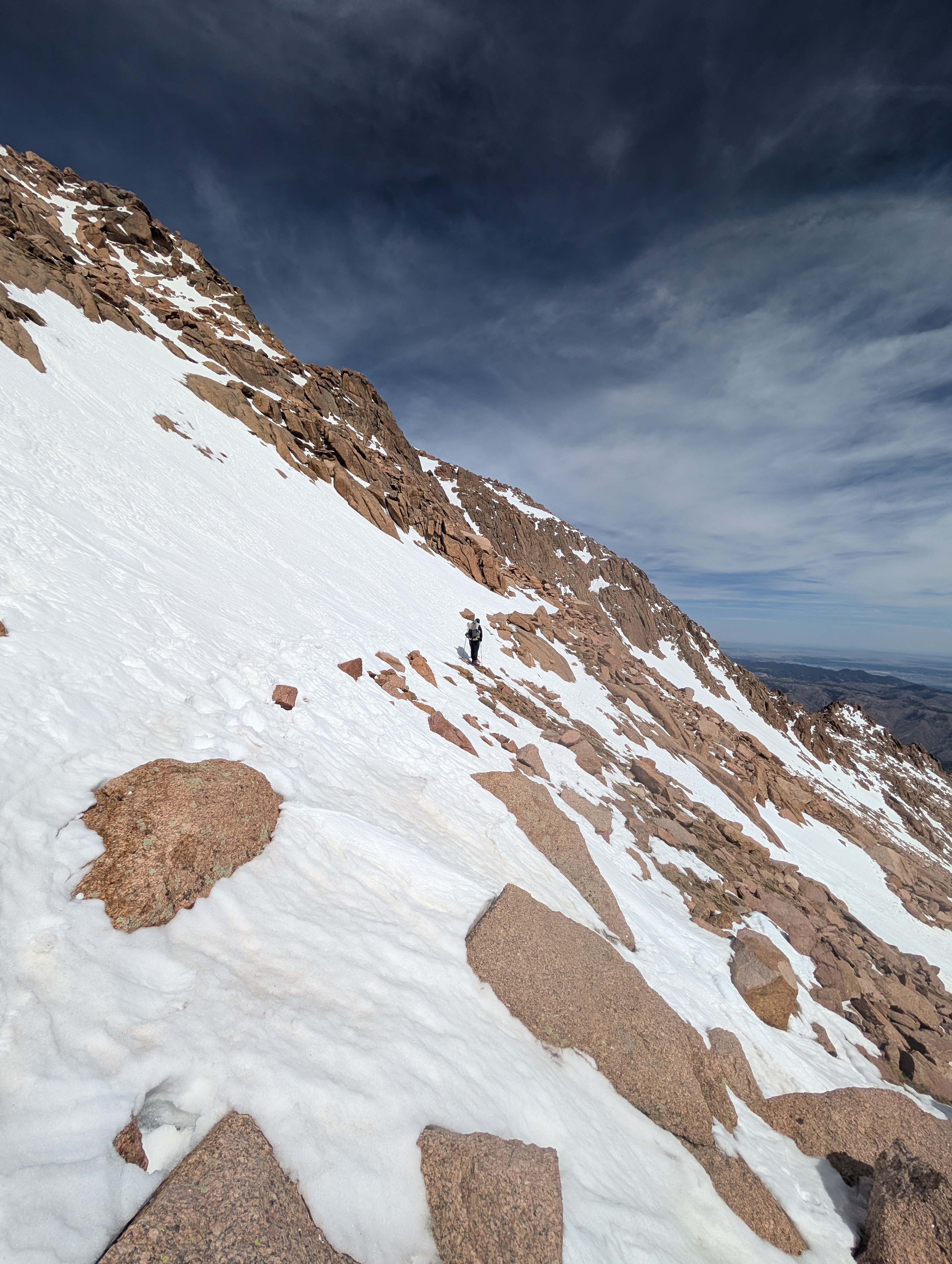 Stunning view of Pikes Peak mountain range in Colorado Springs with a golden-hour glow.