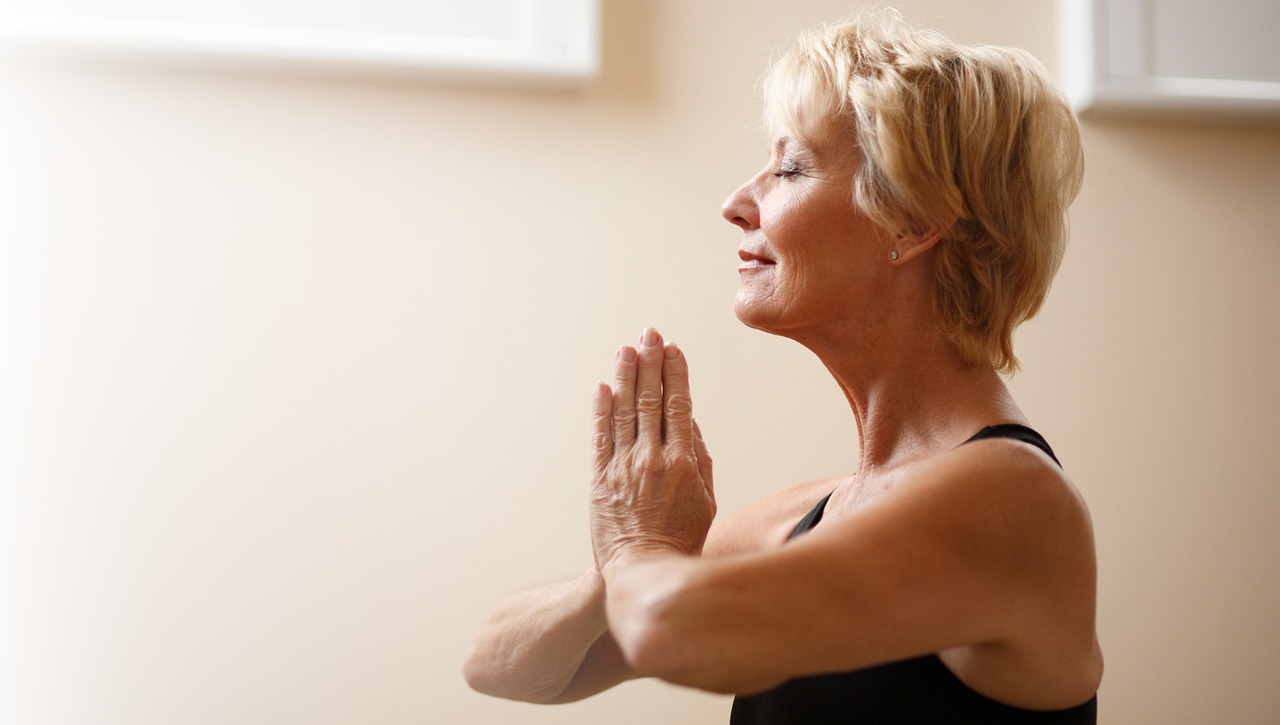 older woman meditates