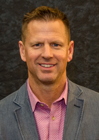 Michael Grieder, real estate professional, smiling in a blazer, showcasing expertise in commercial properties in Connecticut.