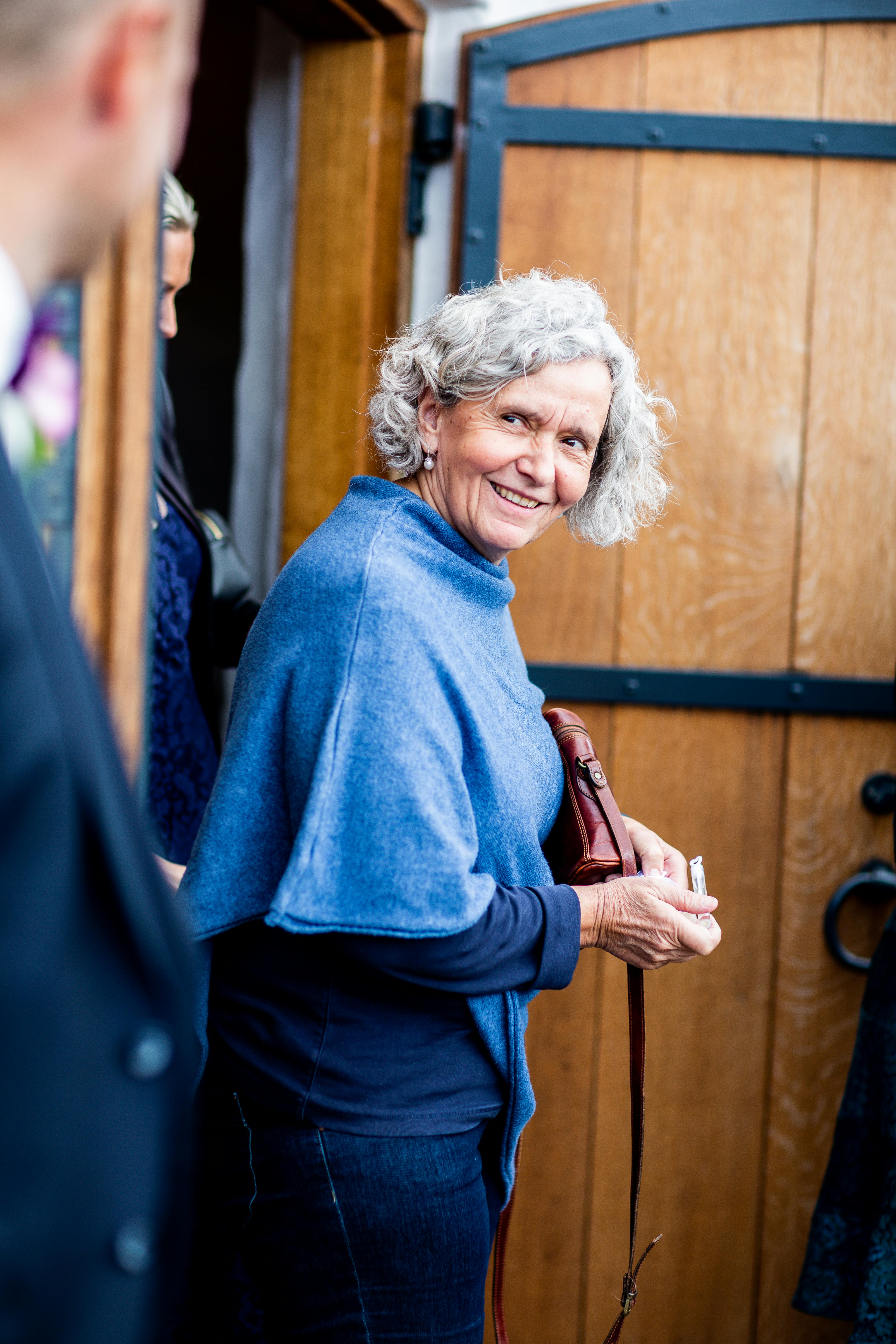 elderly-woman-looking-back-smiling