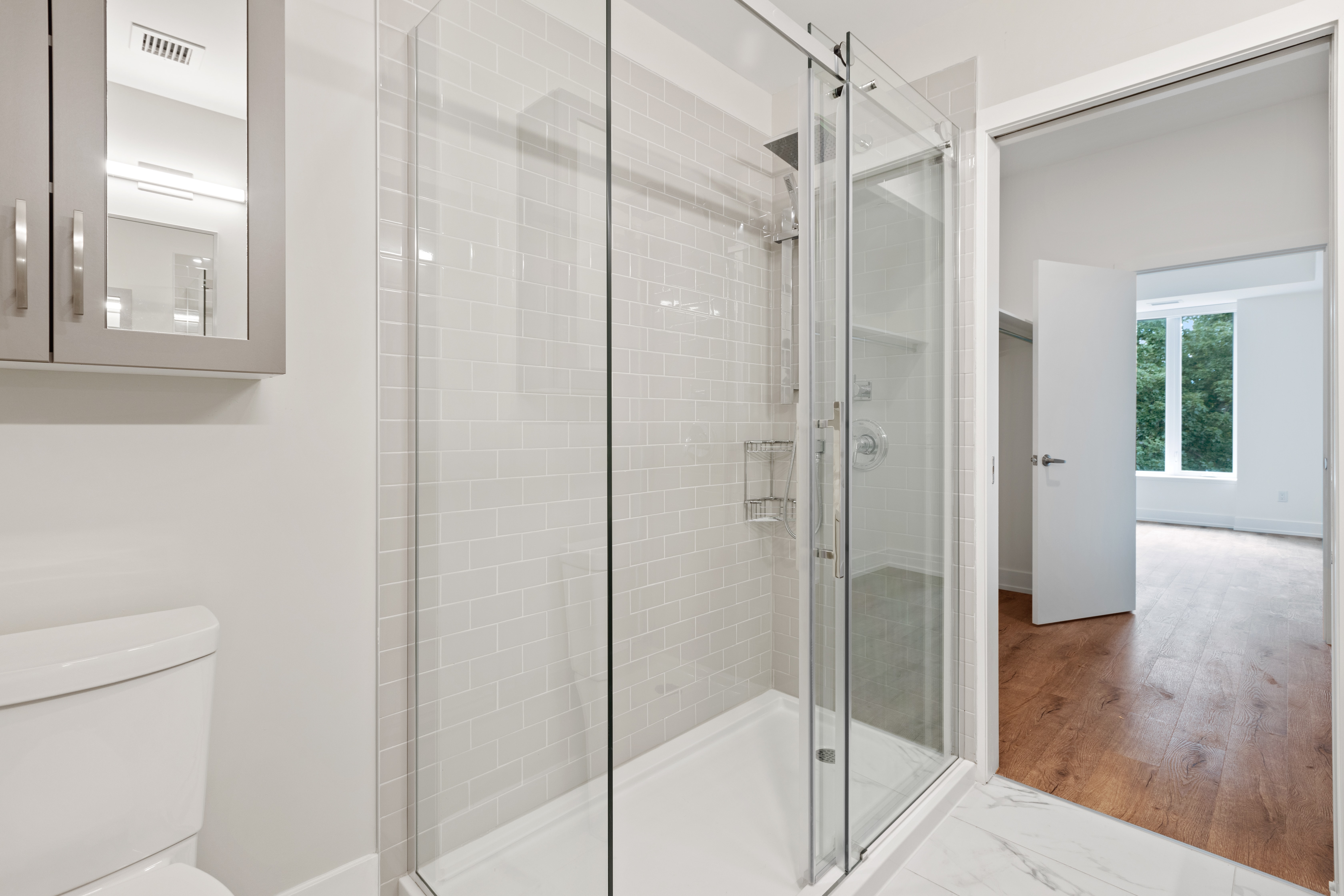Installing shower doors | Bathroom remodeling process | Alabama Construction Pros