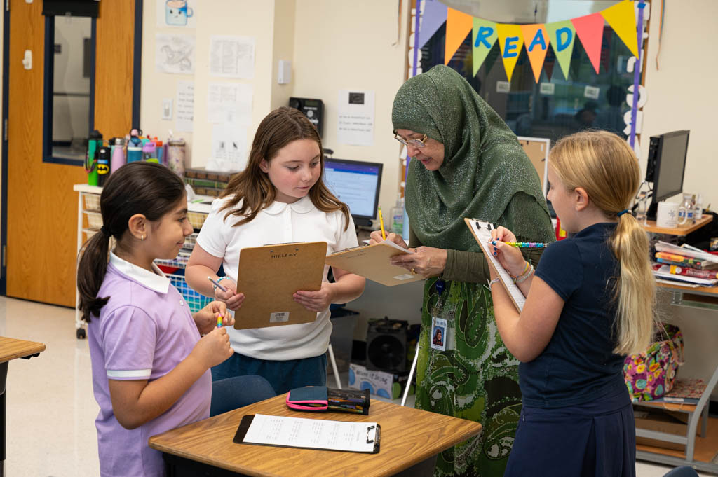 A teacher talking about growth with her students. A teacher talking about growth with her students.