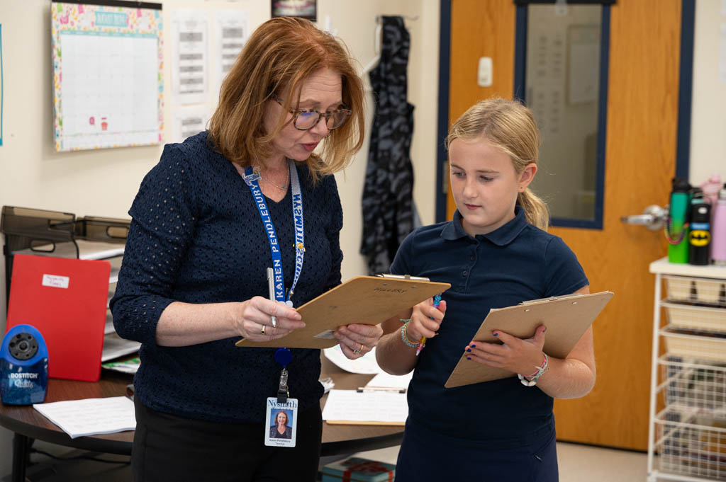 A teacher providing positive feedback. A teacher providing positive feedback.