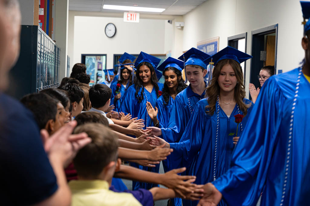 Photo of our Graduates walking through the hallways before they head to high school. Photo of our Graduates walking through the hallways before they head to high school.