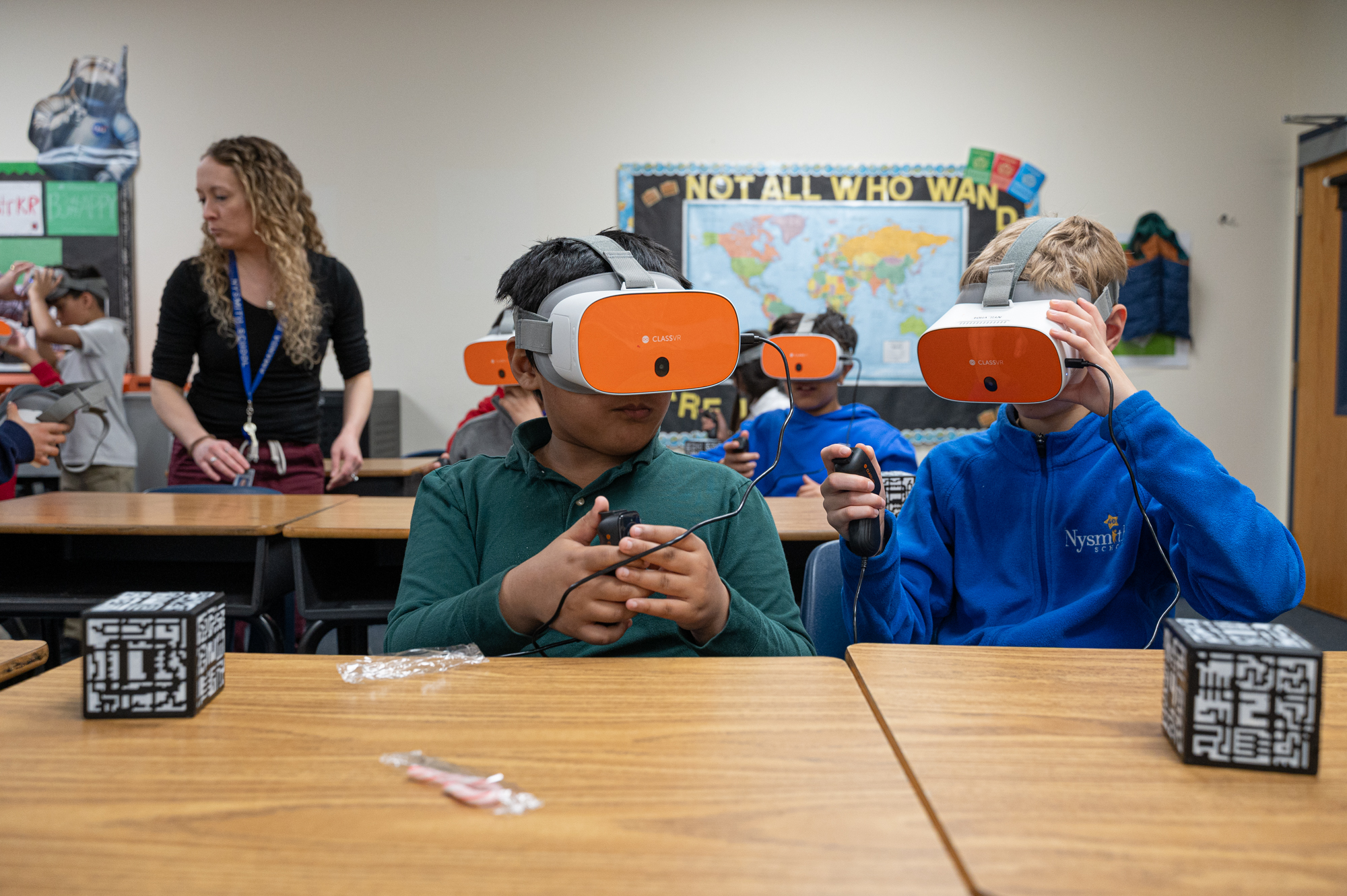 Students using VR Goggles Students using VR Goggles