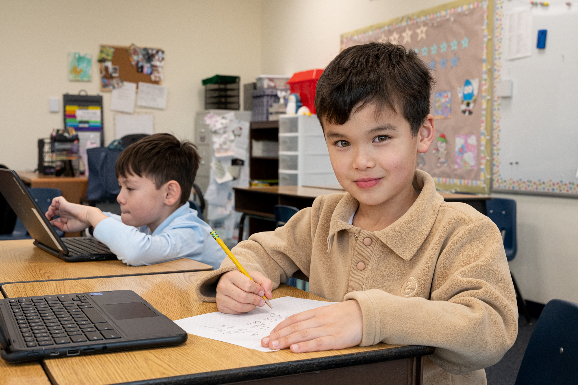 Student working on his homework. Student working on his homework.