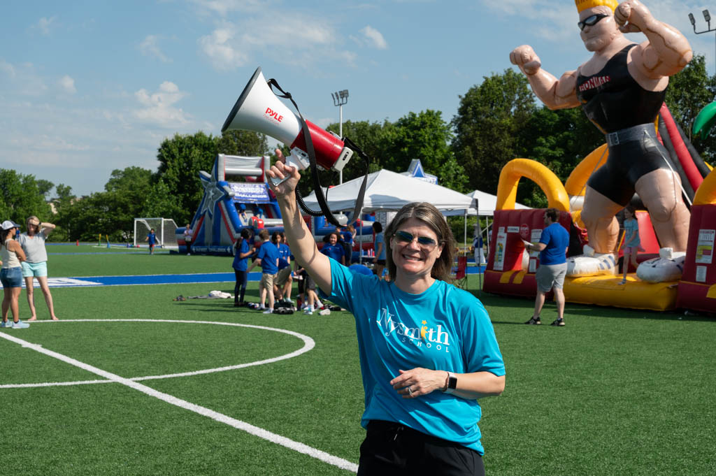 A parent volunteering at the school's Field Day event. A parent volunteering at the school's Field Day event.