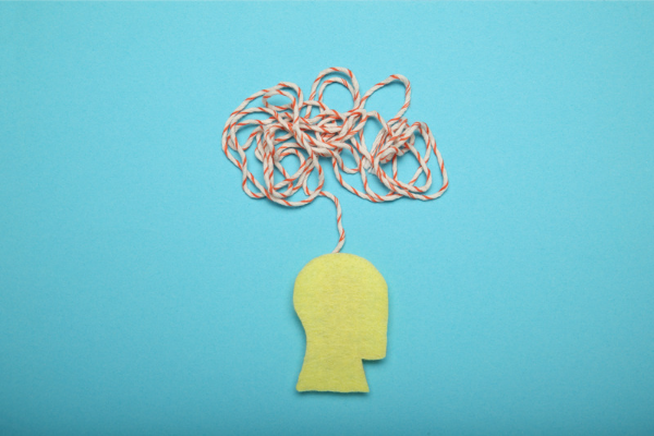 felt head outline with string depicting thoughts 