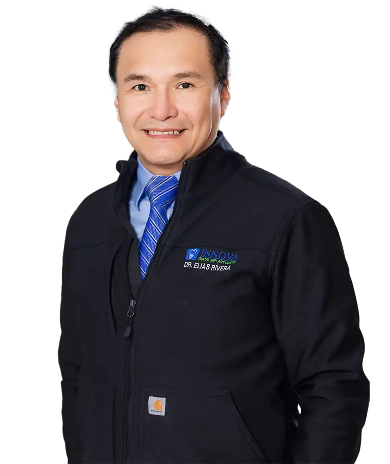 Dr. Elias Rivera smiling with patient and team