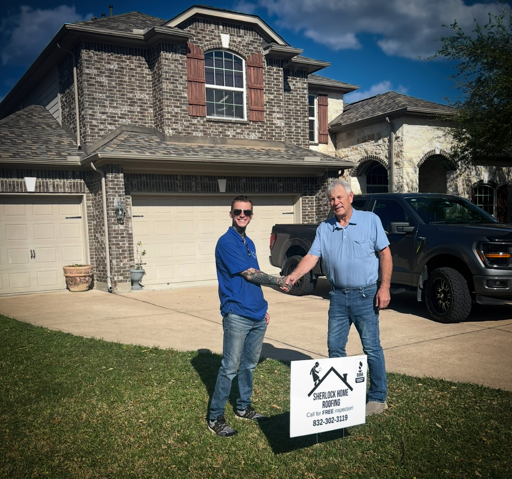 Owner of Sherlock Home Roofing consulting with a homeowner about their roof repair needs