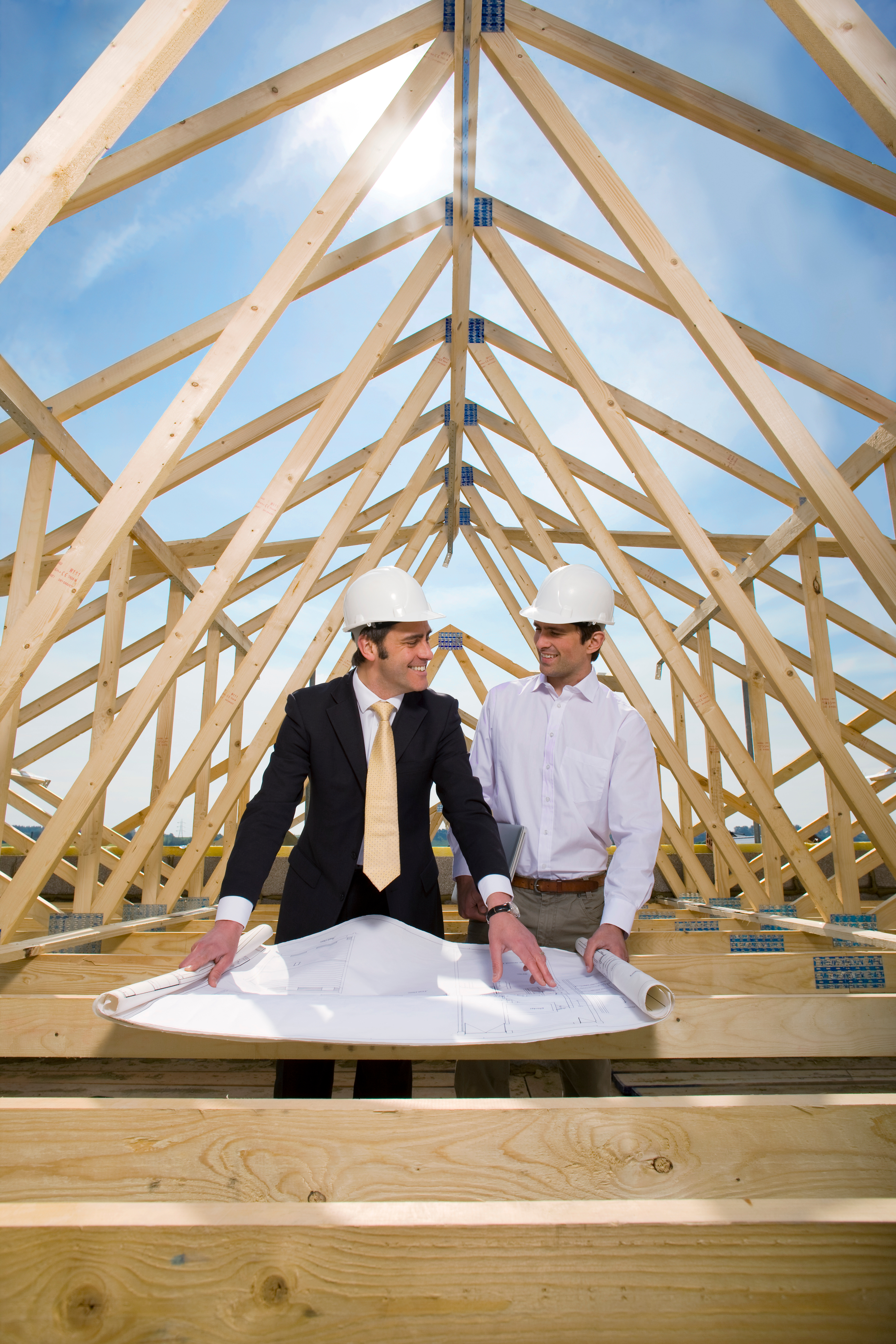 Contractor marking hail impacts on shingles before adjuster meeting