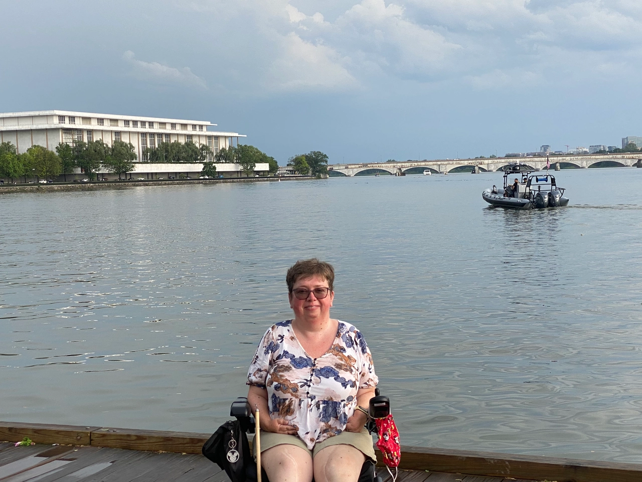 Kelly Mack in front of the Potomac River and the Kennedy Center