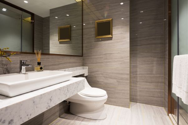 Modern bathroom with marble vanity and large wall tiles. Modern bathroom with marble vanity and large wall tiles.