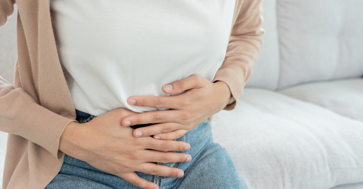 Woman holding tummy