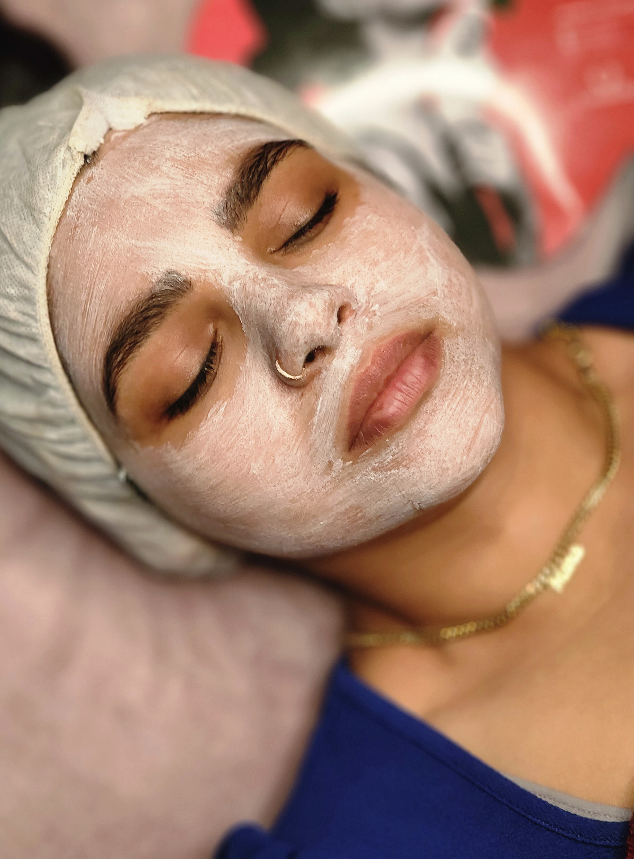 woman experiencing enzyme peel during facial at feather touch aesthetics hobart moonah