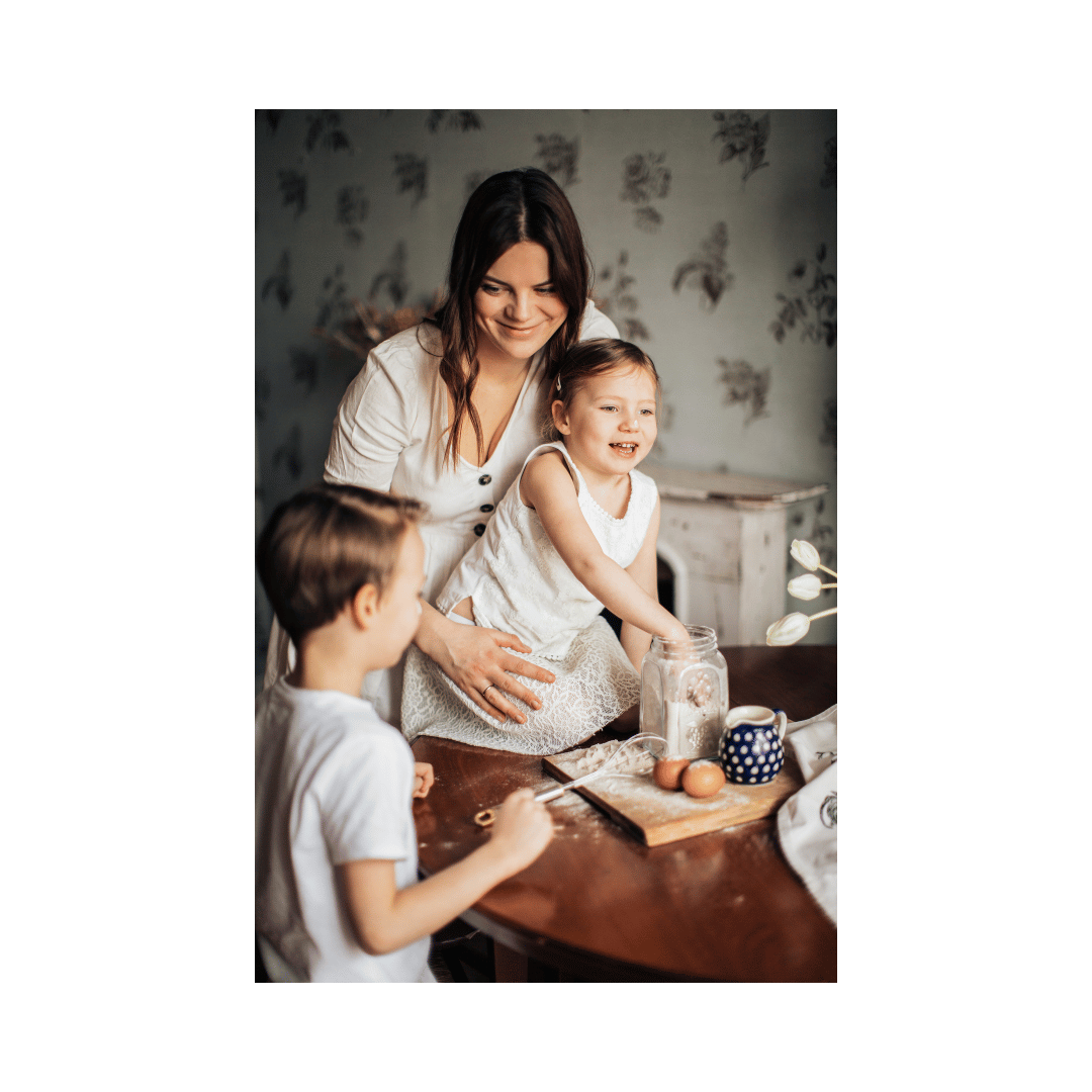 A mom baking with her two young children in a cozy kitchen, illustrating the joy of family time and the balance between motherhood and running a home-based business. A mom baking with her two young children in a cozy kitchen, illustrating the joy of family time and the balance between motherhood and running a home-based business.