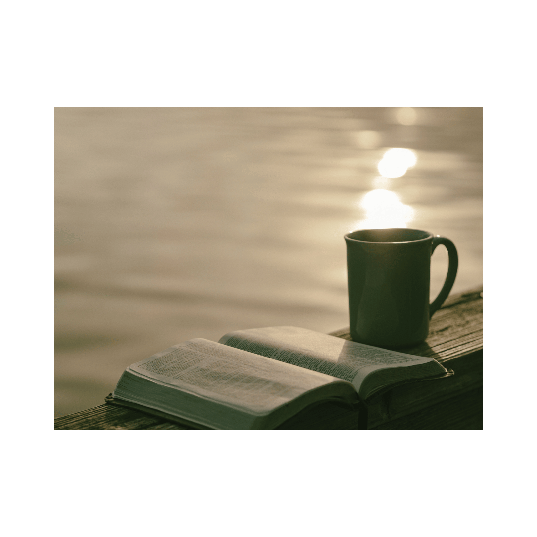 An open Bible and a coffee mug placed on a wooden deck by a peaceful lake, representing the spiritual growth and morning reflection of a mompreneur balancing faith and business. An open Bible and a coffee mug placed on a wooden deck by a peaceful lake, representing the spiritual growth and morning reflection of a mompreneur balancing faith and business.