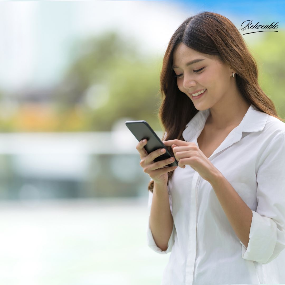  Client interacting with a ReLiveable AI memorial voice companion on a smartphone. 