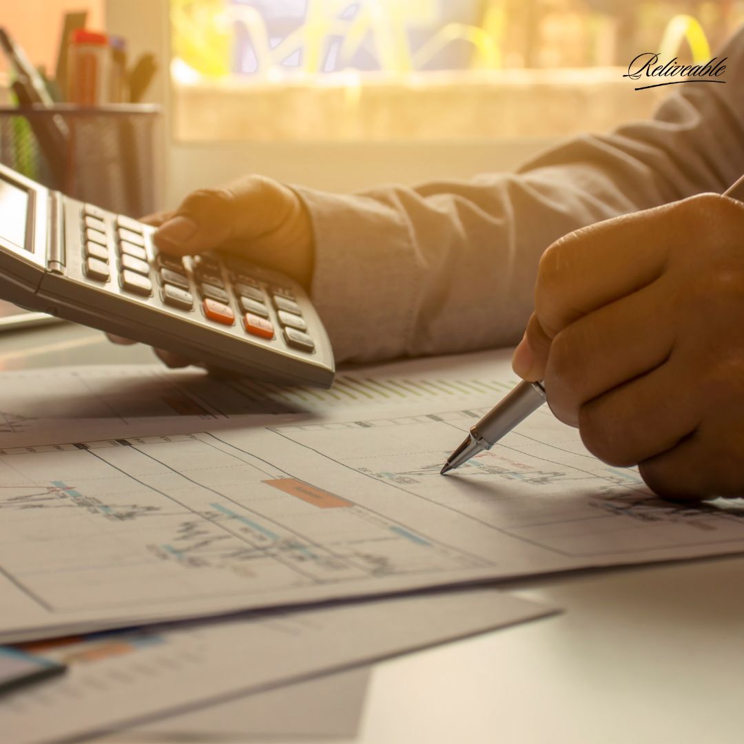  Funeral director reviewing memorial arrangements calmly at their desk.