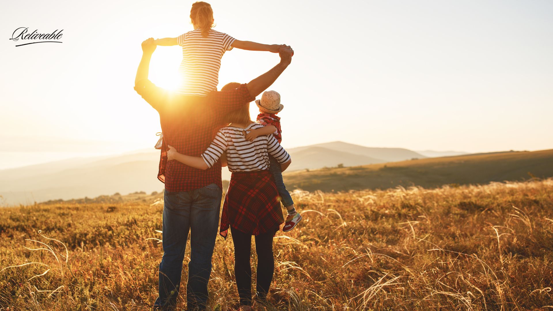 A family sharing a ReLiveable memorial service with children, preserving a loved one’s legacy.