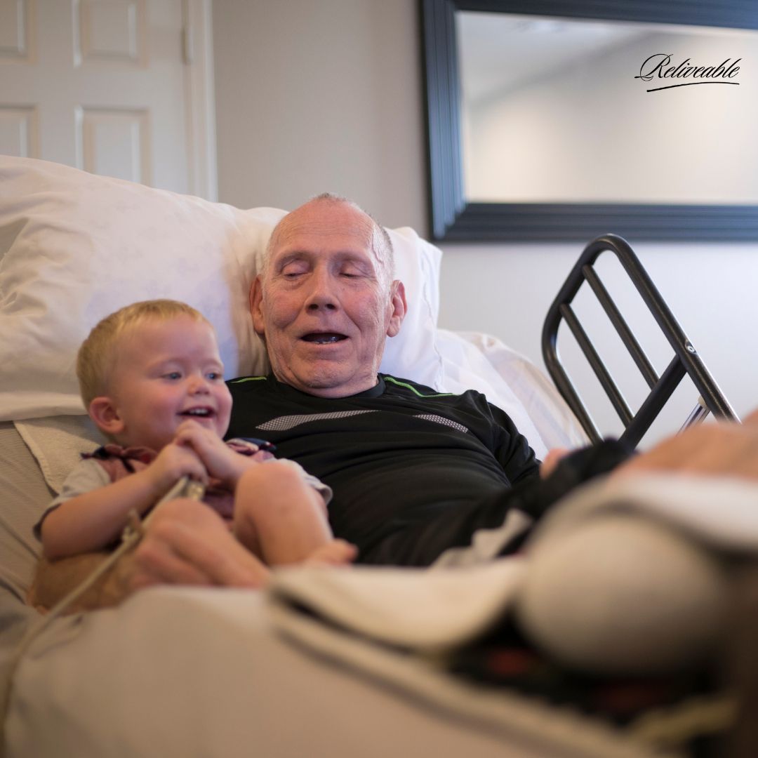 A family member using ReLiveable’s Interactive Reconnection, finding comfort in their loved one’s voice during hospice care.